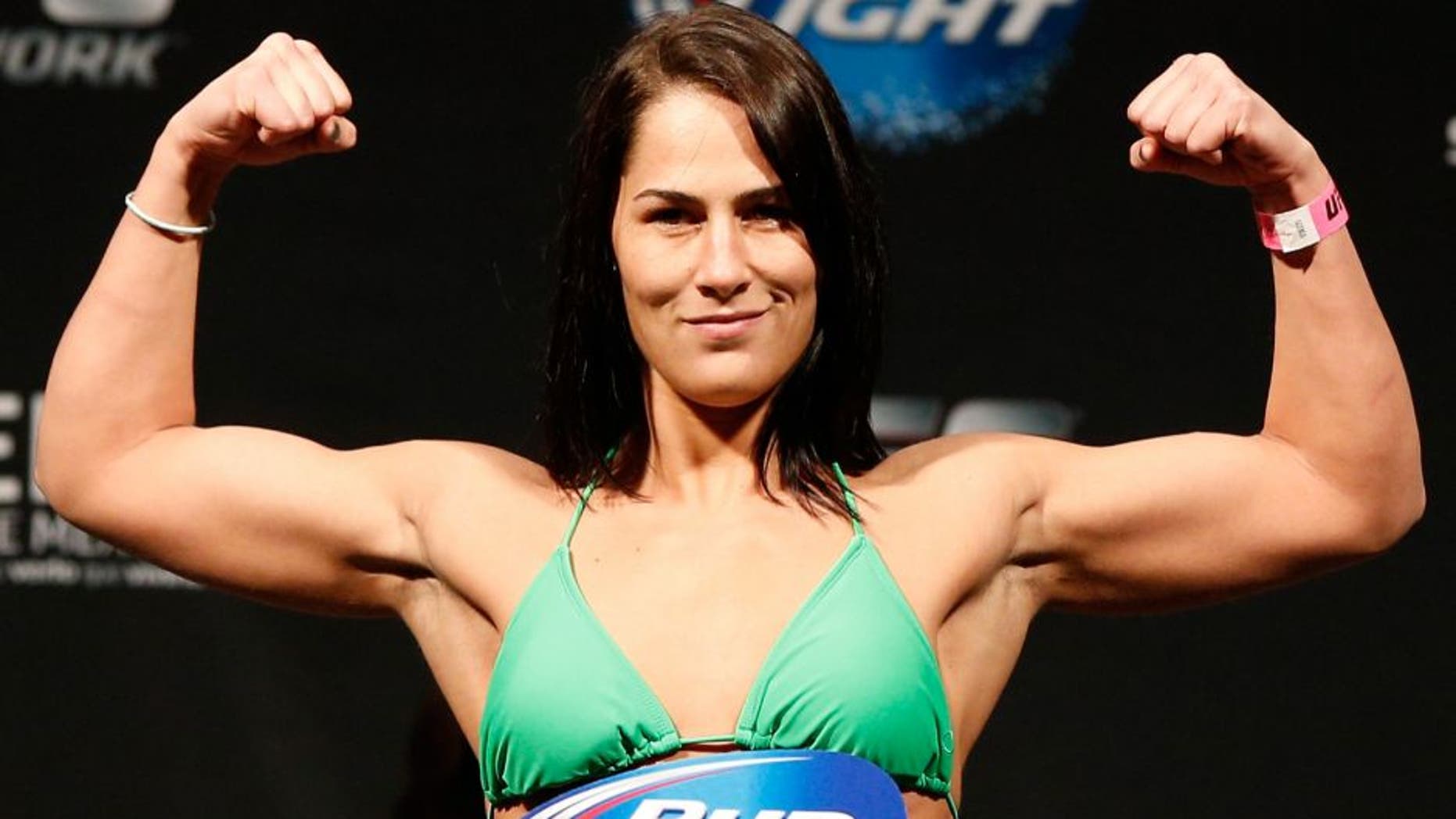 MEXICO CITY, MEXICO - NOVEMBER 14: Jessica Eye of the United States poses on the scale after weighing in during the UFC 180 weigh-in inside the Arena Ciudad de Mexcio on November 14, 2014 in Mexico City, Mexico. (Photo by Josh Hedges/Zuffa LLC/Zuffa LLC via Getty Images)