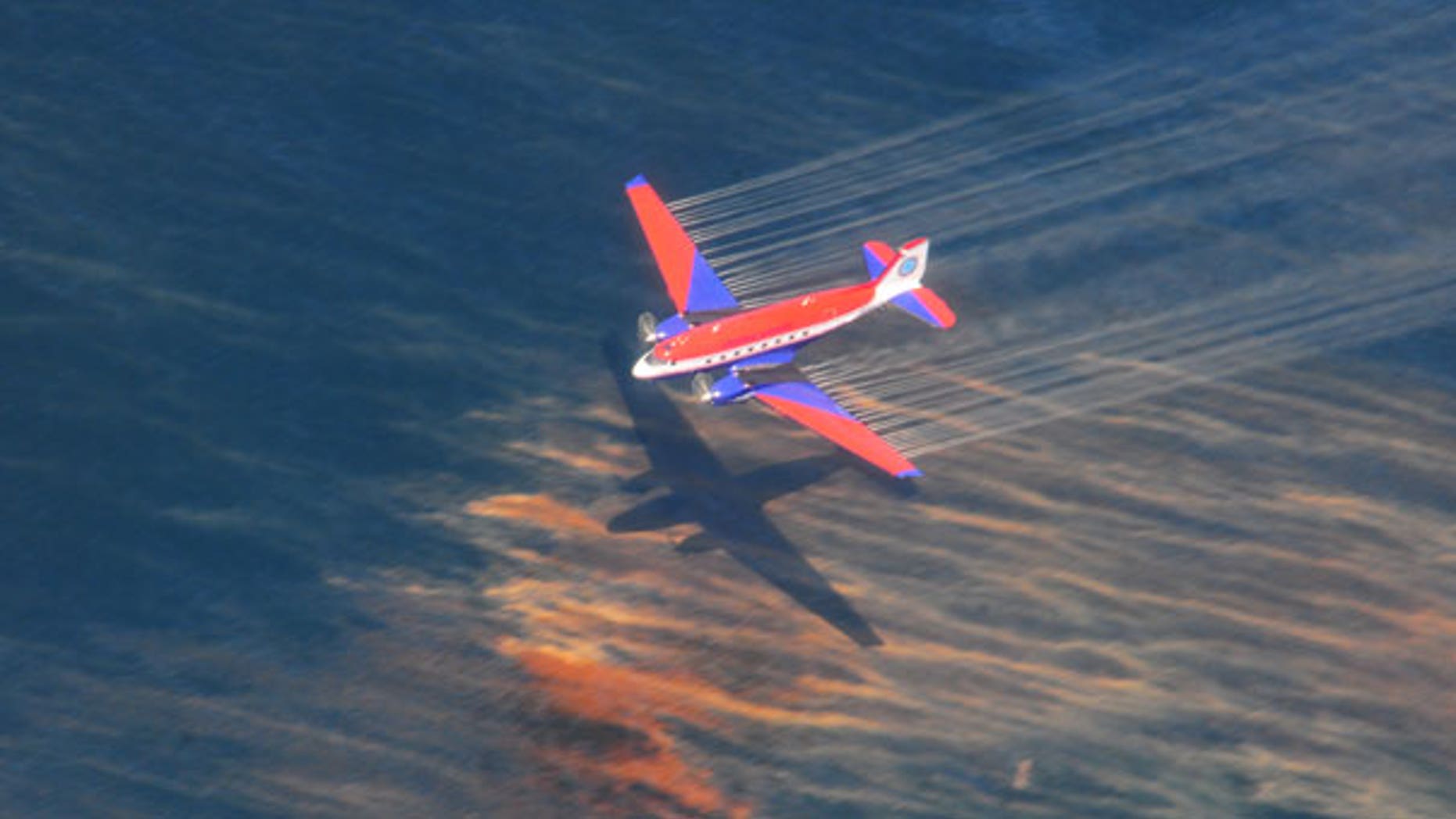May 5: The crew of a Basler BT-67 fixed wing aircraft releases dispersant over an oil discharge off the shore of Louisiana.