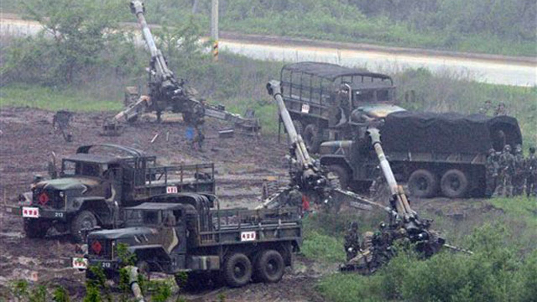 May 25: South Korean artillery soldiers take positions during an exercise against possible North Korean attacks, in Paju, north of Seoul.