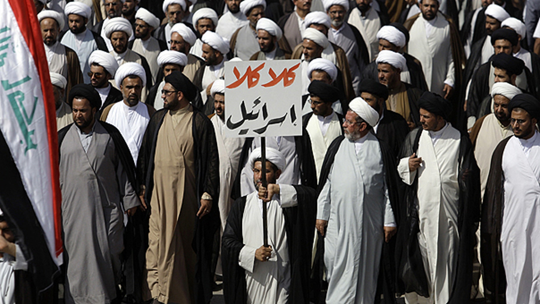 May 26: Supporters of cleric Muqtada al-Sadr march while holding a sign that reads, "no, no to Israel," in Arabic, in the Sadr City district of Baghdad, Iraq.