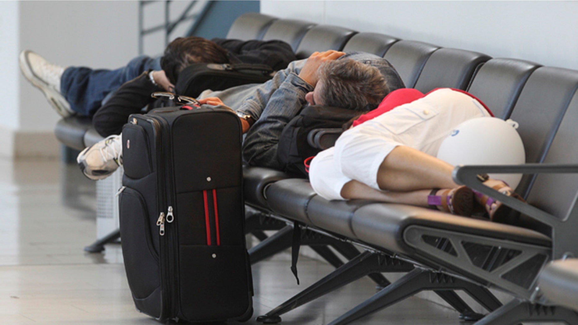 May 25: Passengers rest at the airport in Bremen, northern Germany, after flights were canceled due to elevated levels of ash in the atmosphere stemming from an Icelandic volcano.
