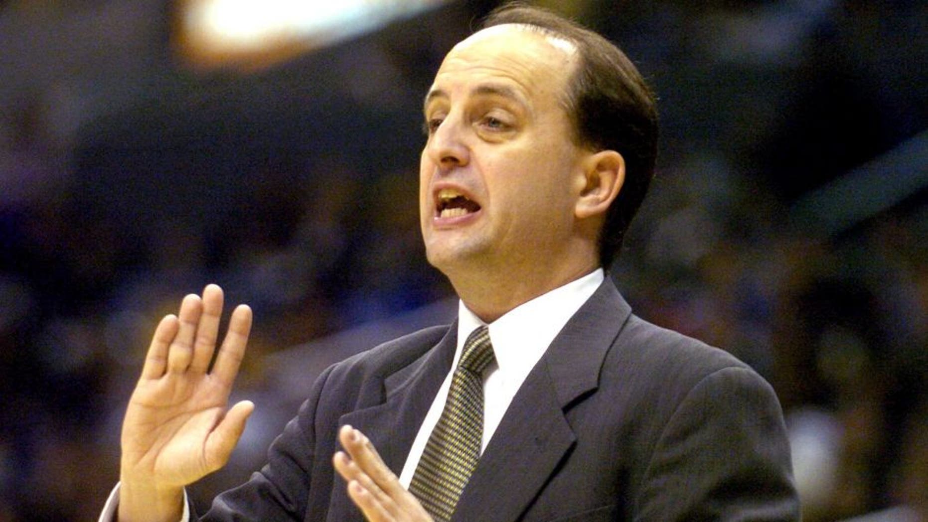 Houston Rockets coach Jeff Van Gundy talks to his team from the bench during the NBA game between the Los Angeles Lakers and the Houston Rockets at the Staples Center in Los Angeles, California, on April 7, 2005. The Rockets defeated the Lakers 114-100. (Photo by Kirby Lee/Getty Images)