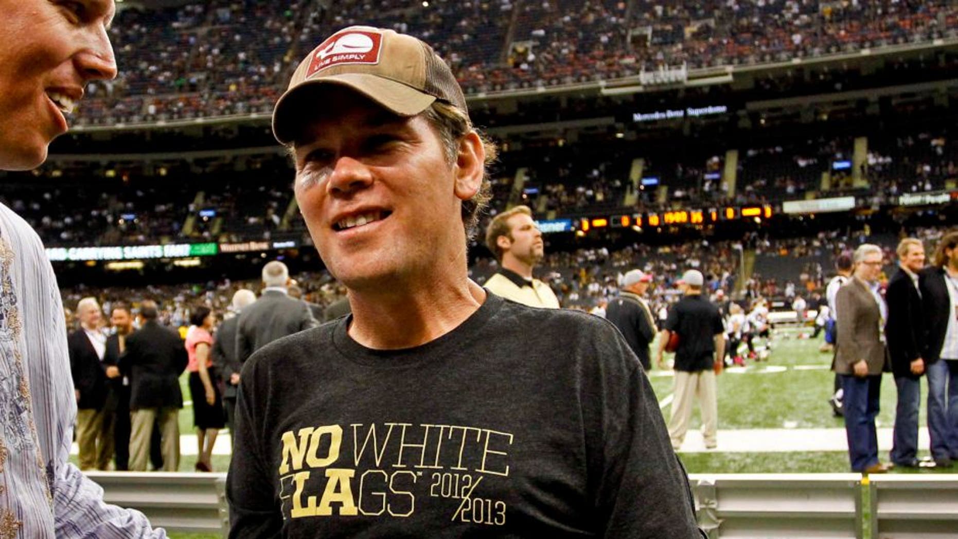 October 7, 2012; New Orleans, LA, USA; Joe Unitas son of former NFL quarterback Johnny Unitas greets former New Orleans Saints defensive back Steve Gleason prior to kickoff of a game against the San Diego Chargers at the Mercedes-Benz Superdome. Mandatory Credit: Derick E. Hingle-USA TODAY Sports