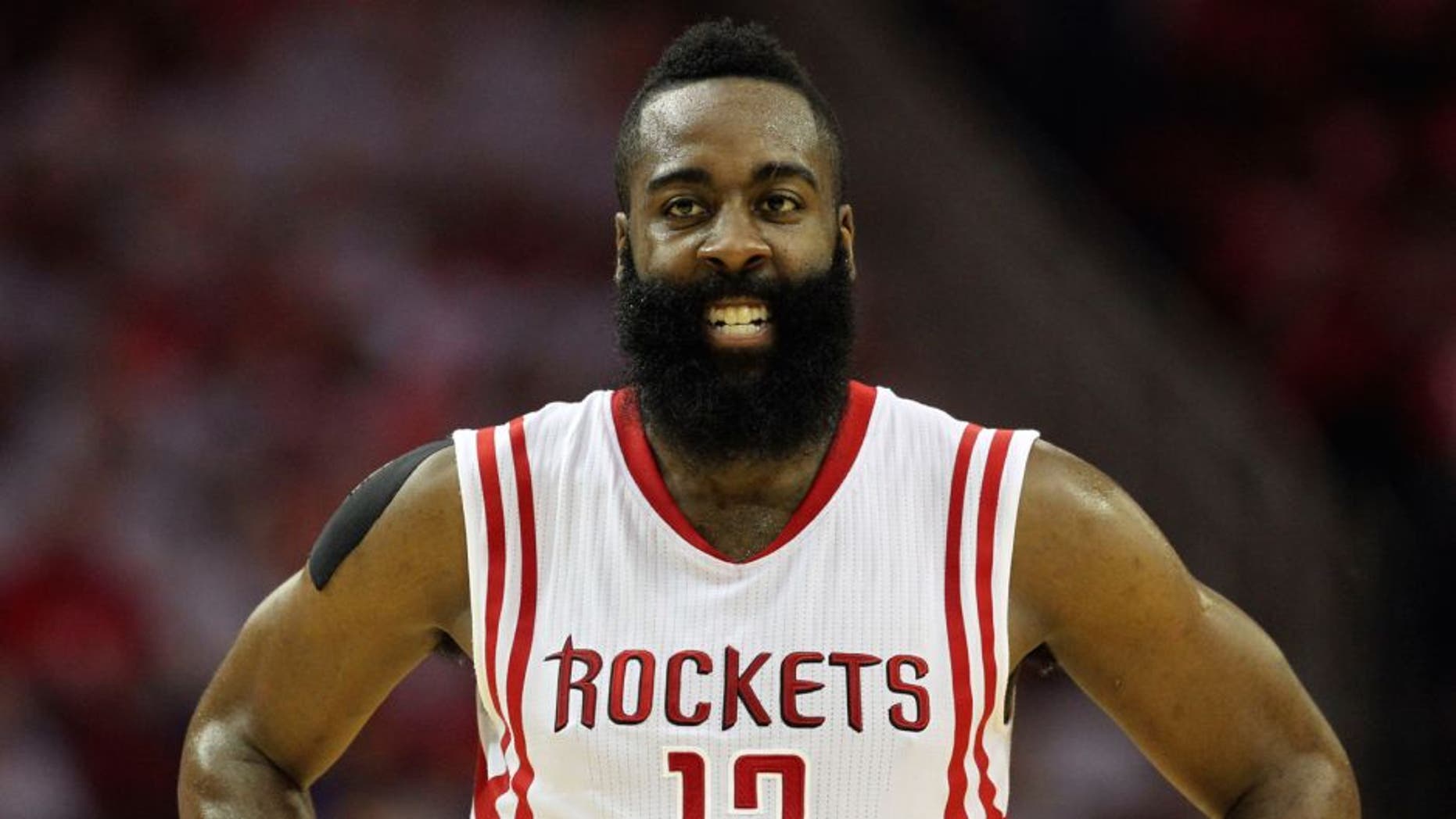 May 23, 2015; Houston, TX, USA; Houston Rockets guard James Harden (13) reacts during the first half against the Golden State Warriors in game three of the Western Conference Finals of the NBA Playoffs at Toyota Center. Mandatory Credit: Troy Taormina-USA TODAY Sports