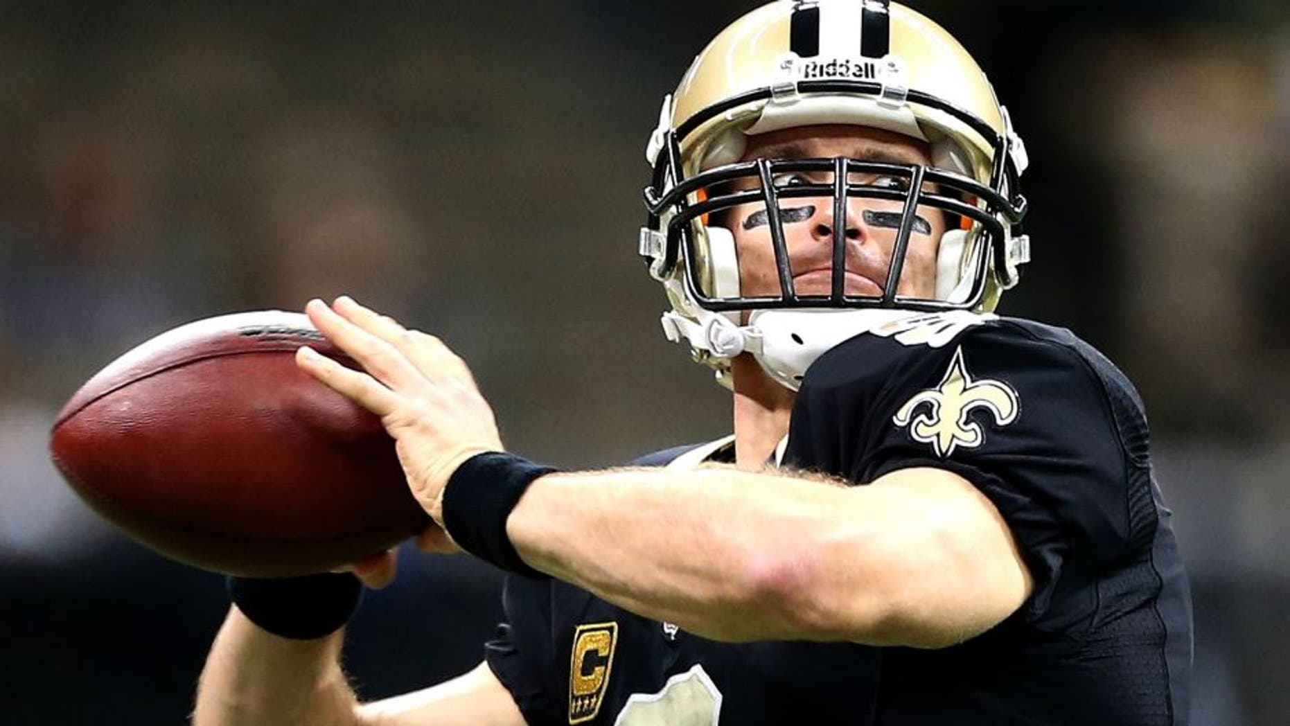 NEW ORLEANS, LA - DECEMBER 29: Drew Brees #9 of the New Orleans Saints warms up before his team takes on the Tampa Bay Buccaneers at Mercedes-Benz Superdome on December 29, 2013 in New Orleans, Louisiana. (Photo by Sean Gardner/Getty Images)
