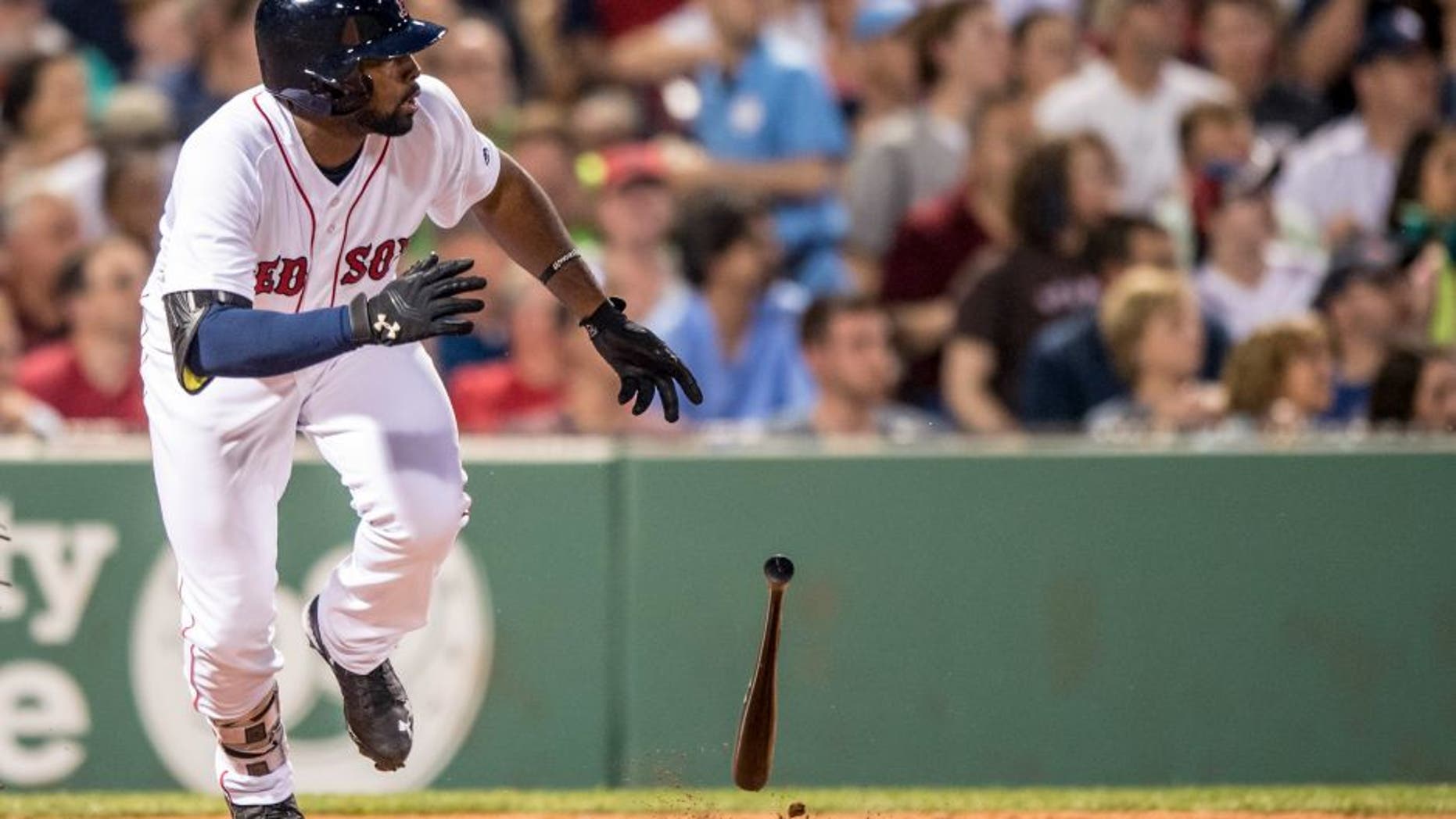 BOSTON, MA - MAY 25: Jackie Bradley Jr. #5 of the Boston Red Sox hits a single during the fourth inning of a game against the Colorado Rockies on May 25, 2016 at Fenway Park in Boston, Massachusetts, extended his hitting streak to 29 straight games. (Photo by Billie Weiss/Boston Red Sox/Getty Images) *** Local Caption *** Jackie Bradley Jr.