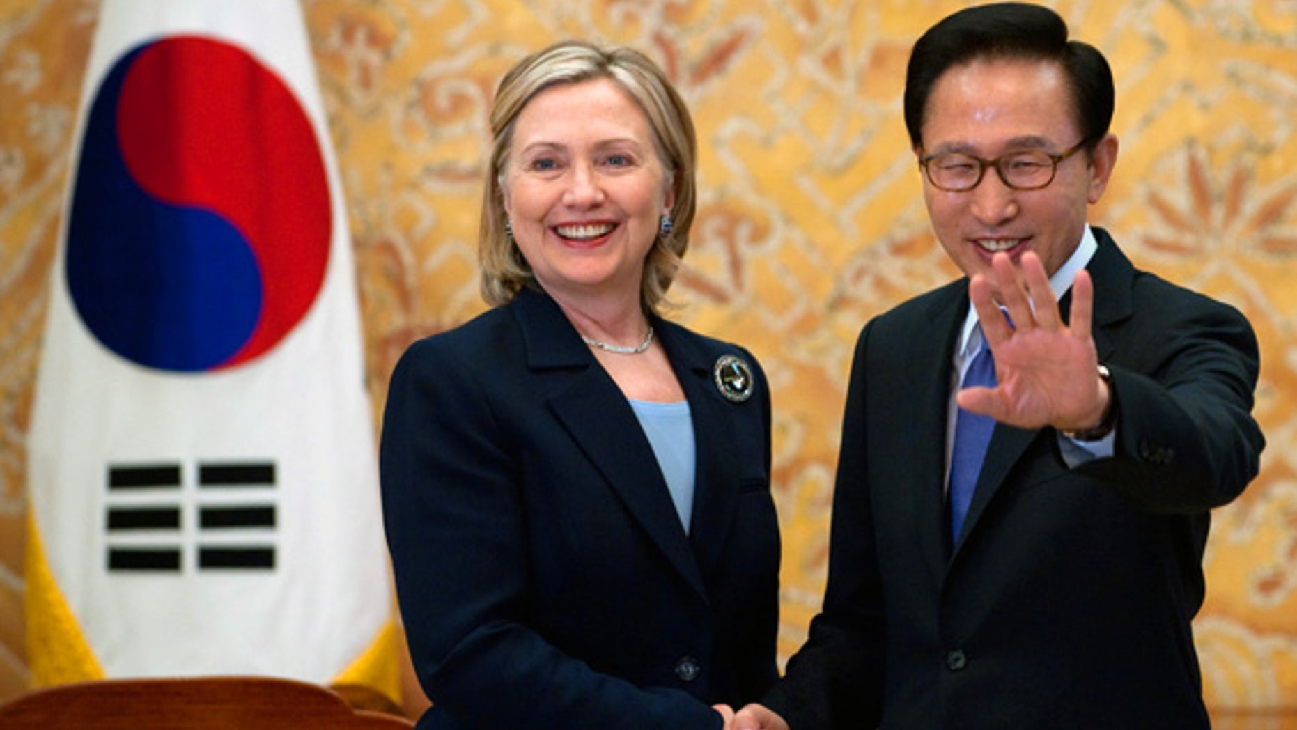 May 26: South Korean President Lee Myung-bak, right, shakes hands with U.S. Secretary of State Hillary Rodham Clinton during their meeting at the Presidential Blue House in Seoul, South Korea.