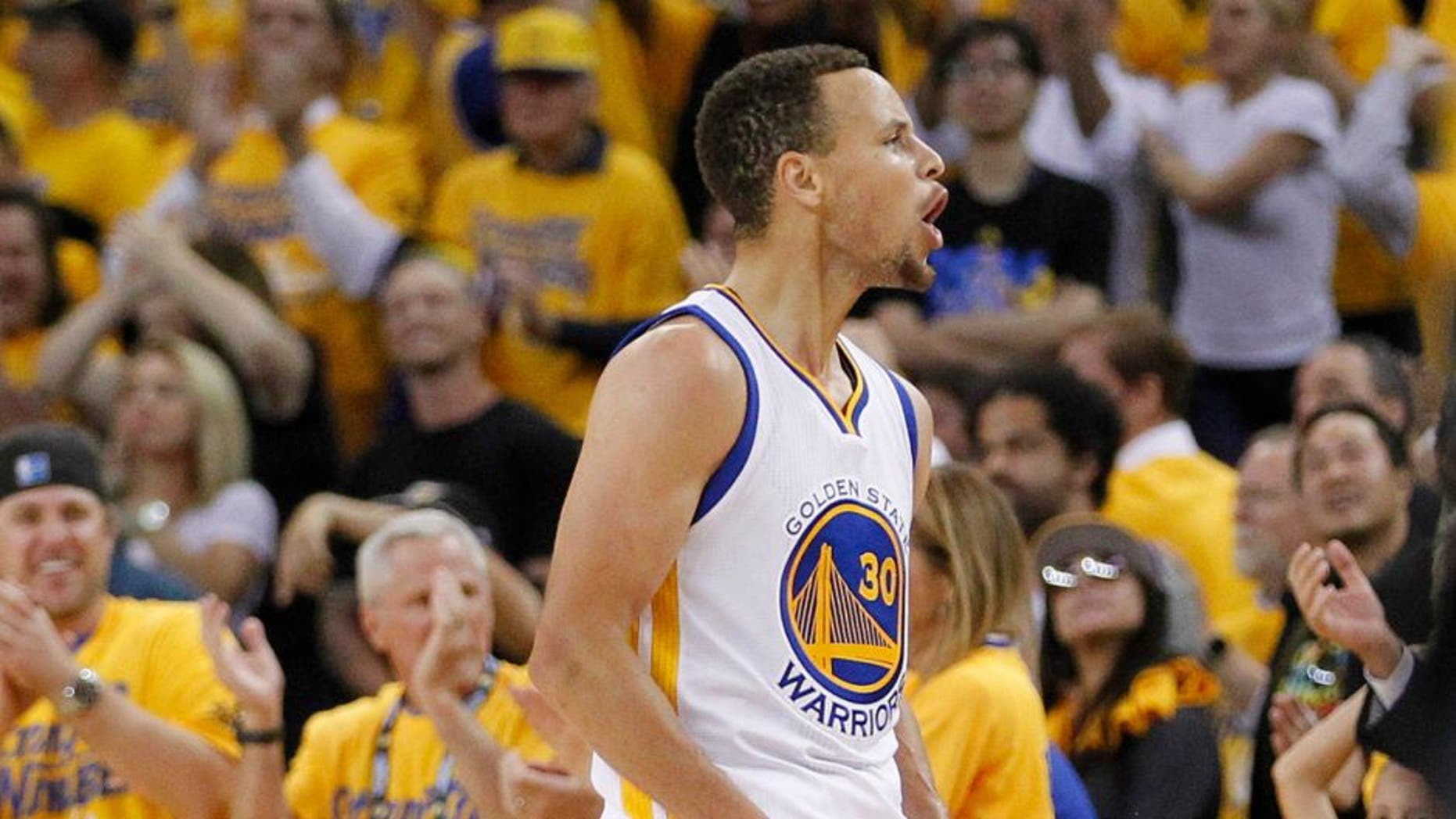May 26, 2016; Oakland, CA, USA; Golden State Warriors guard Stephen Curry (30) celebrates after scoring against the Oklahoma City Thunder in the fourth quarter in game five of the Western conference finals of the NBA Playoffs at Oracle Arena. The Warriors defeated the Thunder 120-111. Mandatory Credit: Cary Edmondson-USA TODAY Sports