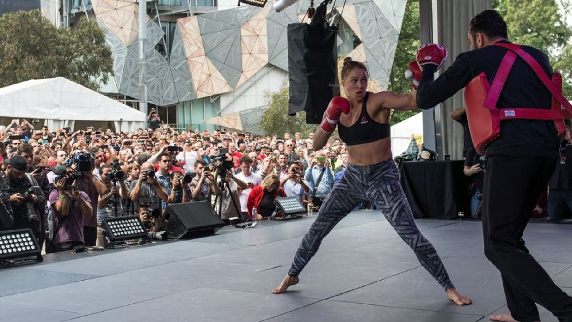 MELBOURNE, AUSTRALIA - NOVEMBER 12: UFC women's bantamweight champion Ronda Rousey of the United States holds an open workout for fans and media at Federation Square on November 12, 2015 in Melbourne, Australia. (Photo by Brandon Magnus/Zuffa LLC/Zuffa LLC via Getty Images)