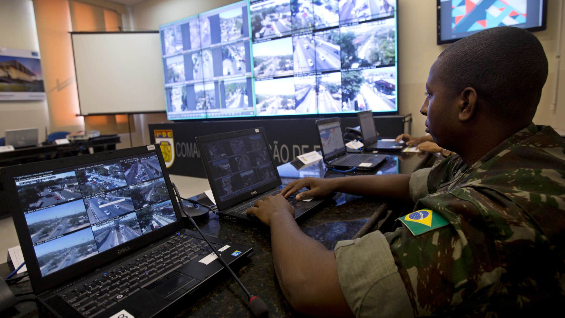 April 20, 2016: a soldier watches live video showing streets near Olympic venues in Rio de Janeiro, Brazil. Rio de Janeiro’s state Security Secretary Jose Mariano Beltrame said he will deploy the largest contingent of police and soldiers in Brazilian history to guard the games.