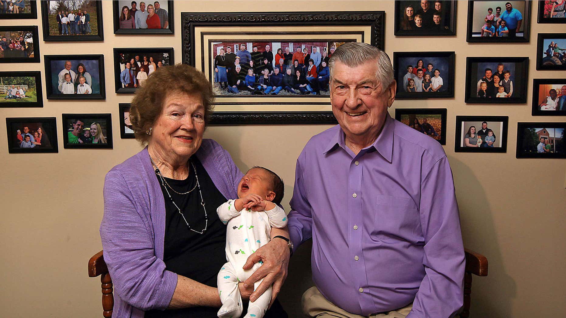 April 17, 2015: Leo and Ruth Zanger sit with their 100th grandchild, Jaxton Zanger, in Leo's real estate office in Quincy, Ill.