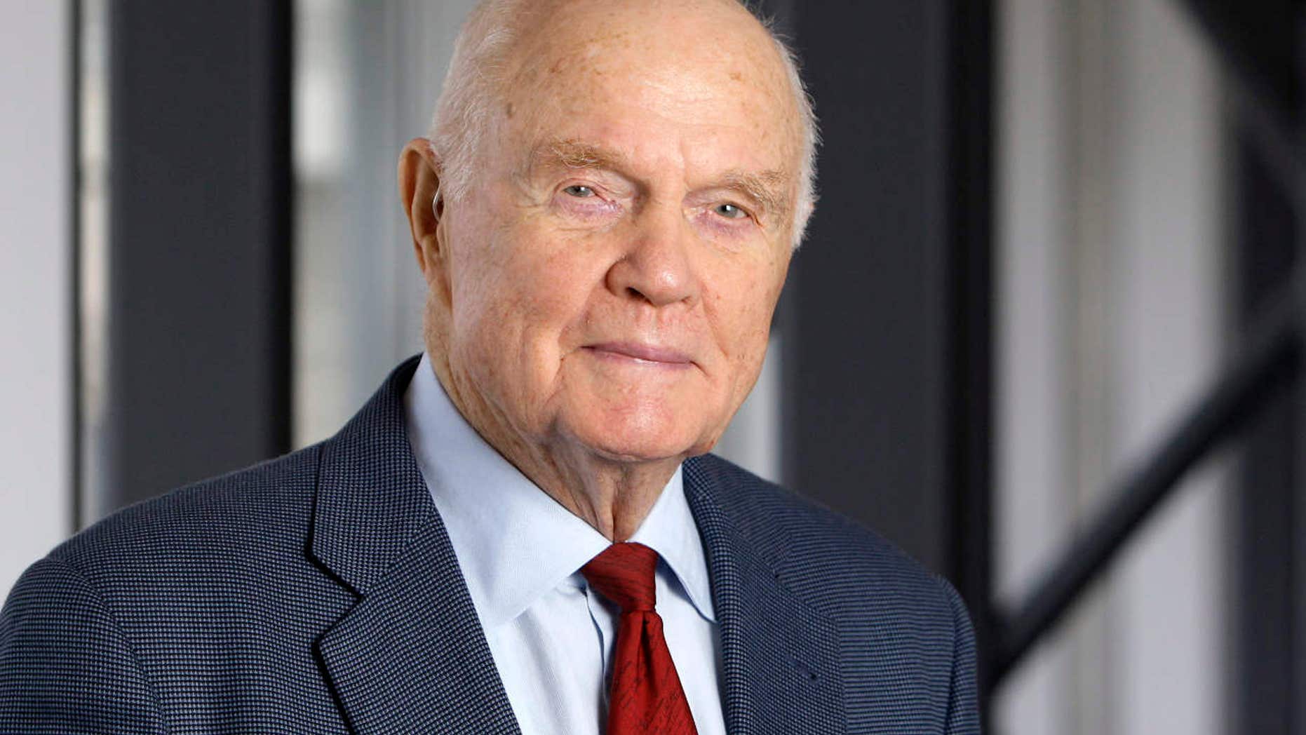 FILE - In this Jan. 25, 2012, file photo, former astronaut and Sen. John Glenn poses for a photo during an interview at his office in Columbus, Ohio.