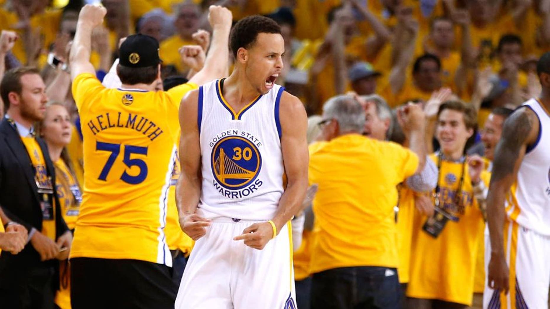 OAKLAND, CA - MAY 21: Stephen Curry #30 and Klay Thompson #11 of the Golden State Warriors react after defeating the Houston Rockets during game two of the Western Conference Finals of the 2015 NBA PLayoffs at ORACLE Arena on May 21, 2015 in Oakland, California. NOTE TO USER: User expressly acknowledges and agrees that, by downloading and or using this photograph, user is consenting to the terms and conditions of Getty Images License Agreement. (Photo by Ezra Shaw/Getty Images)