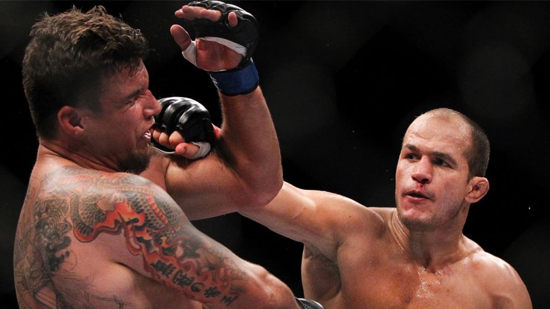LAS VEGAS, NV - MAY 26: (R-L) Junior dos Santos punches Frank Mir during the Heavyweight Championship bout at UFC 146 at MGM Grand Garden Arena on May 26, 2012 in Las Vegas, Nevada. (Photo by Josh Hedges/Zuffa LLC/Zuffa LLC via Getty Images)