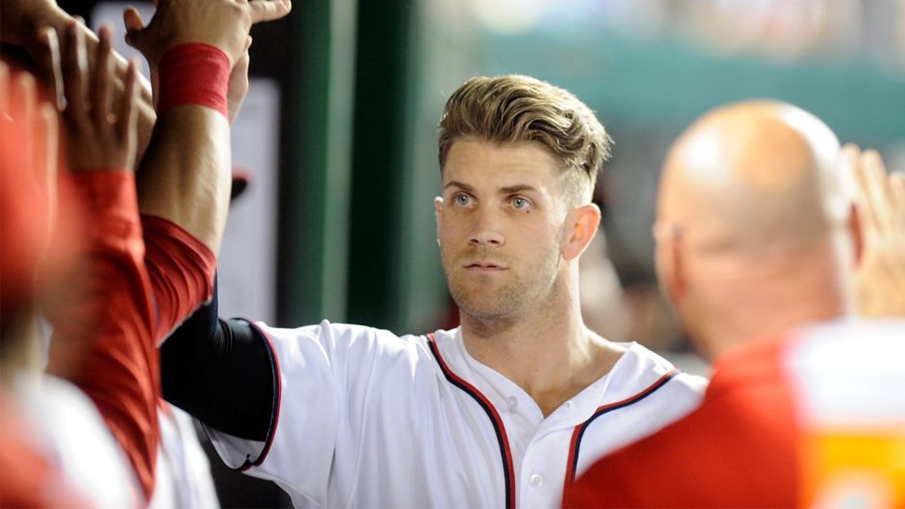 Bryce Harper #34 of the Washington Nationals celebrates with teammates after hitting a home run in the sixth inning against the St. Louis Cardinals at Nationals Park on May 26, 2016 in Washington, DC. (Photo by Greg Fiume/Getty Images)