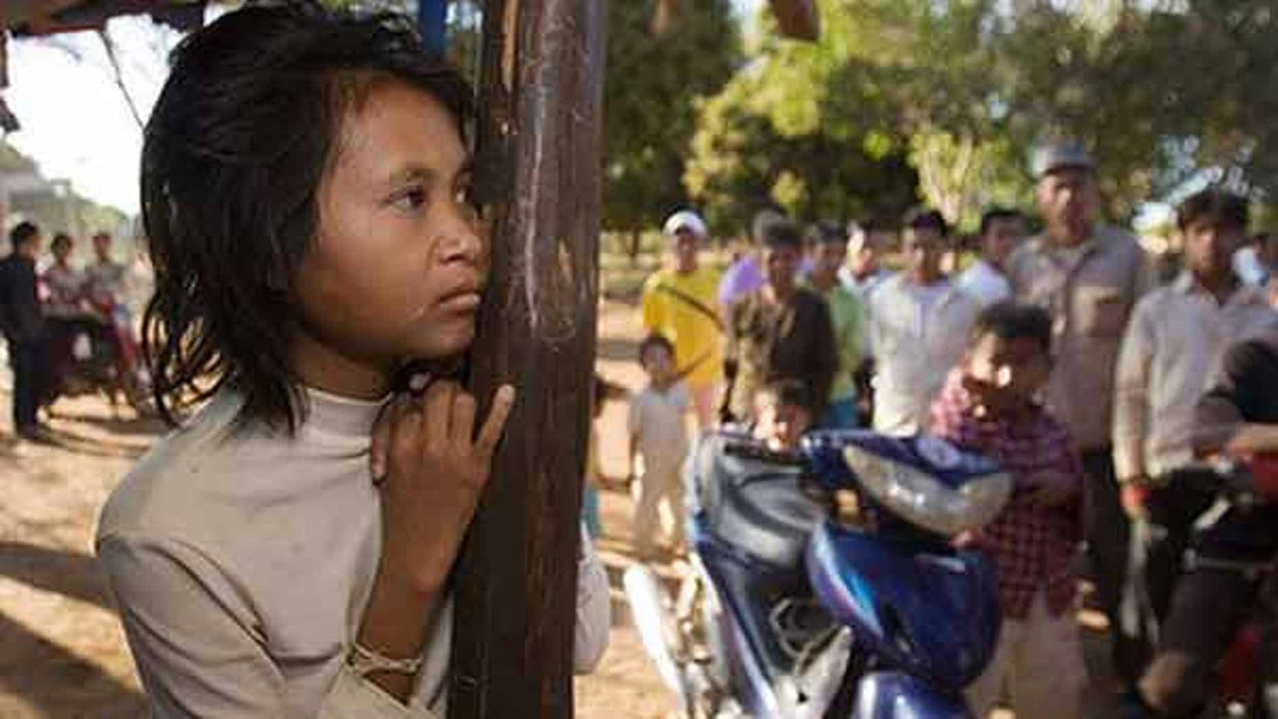 FILE: A woman dubbed the "jungle woman" after emerging naked and unable to speak from the wilds of northeastern Cambodia three years ago has apparently fled back to the forest, police said.