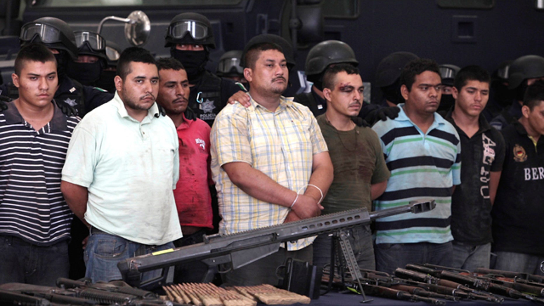 May 28: Federal police present to the news media a cache of weapons and nearly 50 suspects of two major drug cartels in Mexico City.