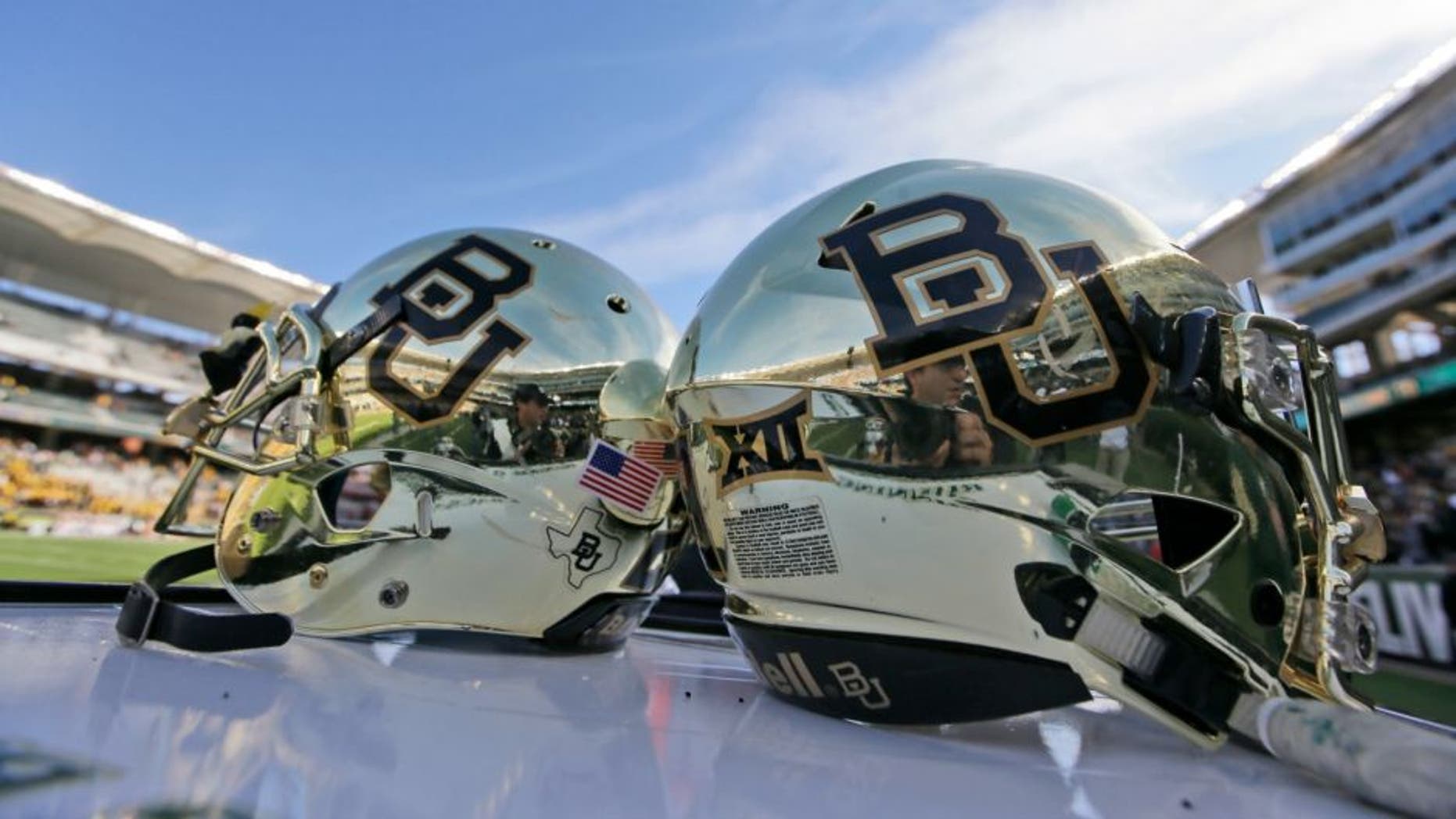 FILE - In this Dec. 5, 2015, file photo, Baylor helmets on shown the field after an NCAA college football game in Waco, Texas. Baylor University will look to rebuild its reputation and perhaps its football program after an outside review found administrators mishandled allegations of sexual assault and the team operated under the perception it was above the rules. (AP Photo/LM Otero, File)