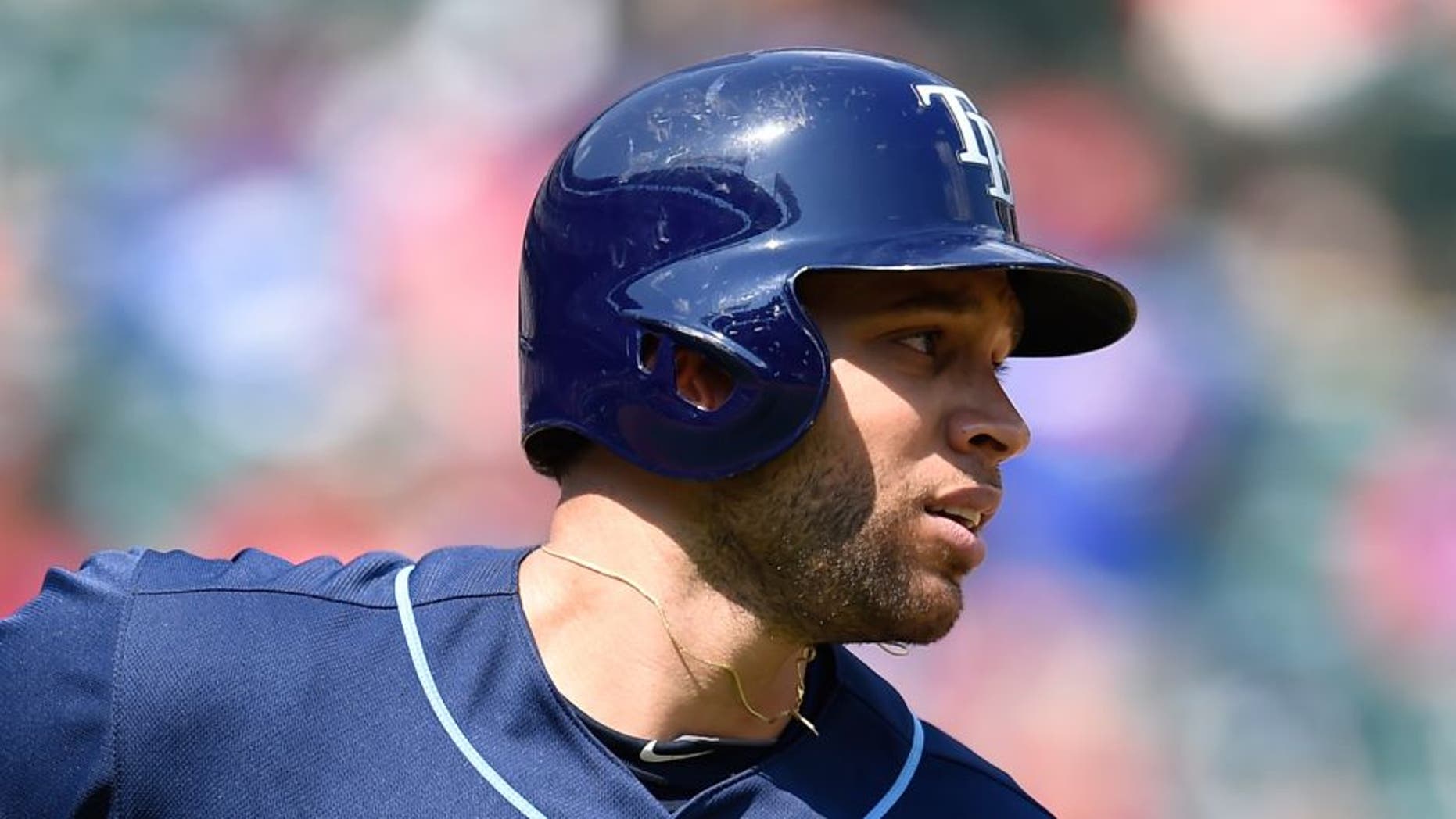 ARLINGTON, TX - AUGUST 16: James Loney #21 of the Tampa Bay Rays runs to first base after hitting the ball in the game against the Texas Rangers at Globe Life Park in Arlington on August 16, 2015 in Arlington, Texas. The Texas Rangers defeated the Tampa Bay Rays 5-3. (Photo by John Williamson/MLB Photos via Getty Images)