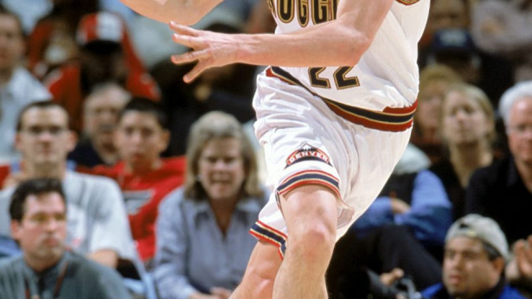 DENVER - FEBRUARY 19: Nikoloz Tskitishvili #22 of the Denver Nuggets drives during the NBA game against the Minnesota Timberwolves at Pepsi Center on February 19, 2003 in Denver, Colorado. The Timberwolves defeated the Nuggets 85-77. NOTE TO USER: User expressly acknowledges and agrees that, by downloading and/or using this Photograph, User is consenting to the terms and conditions of the Getty Images License Agreement. Mandatory Copyright Notice: Copyright 2003 NBAE (Photo by Garrett Ellwood/NBAE/Getty Images)
