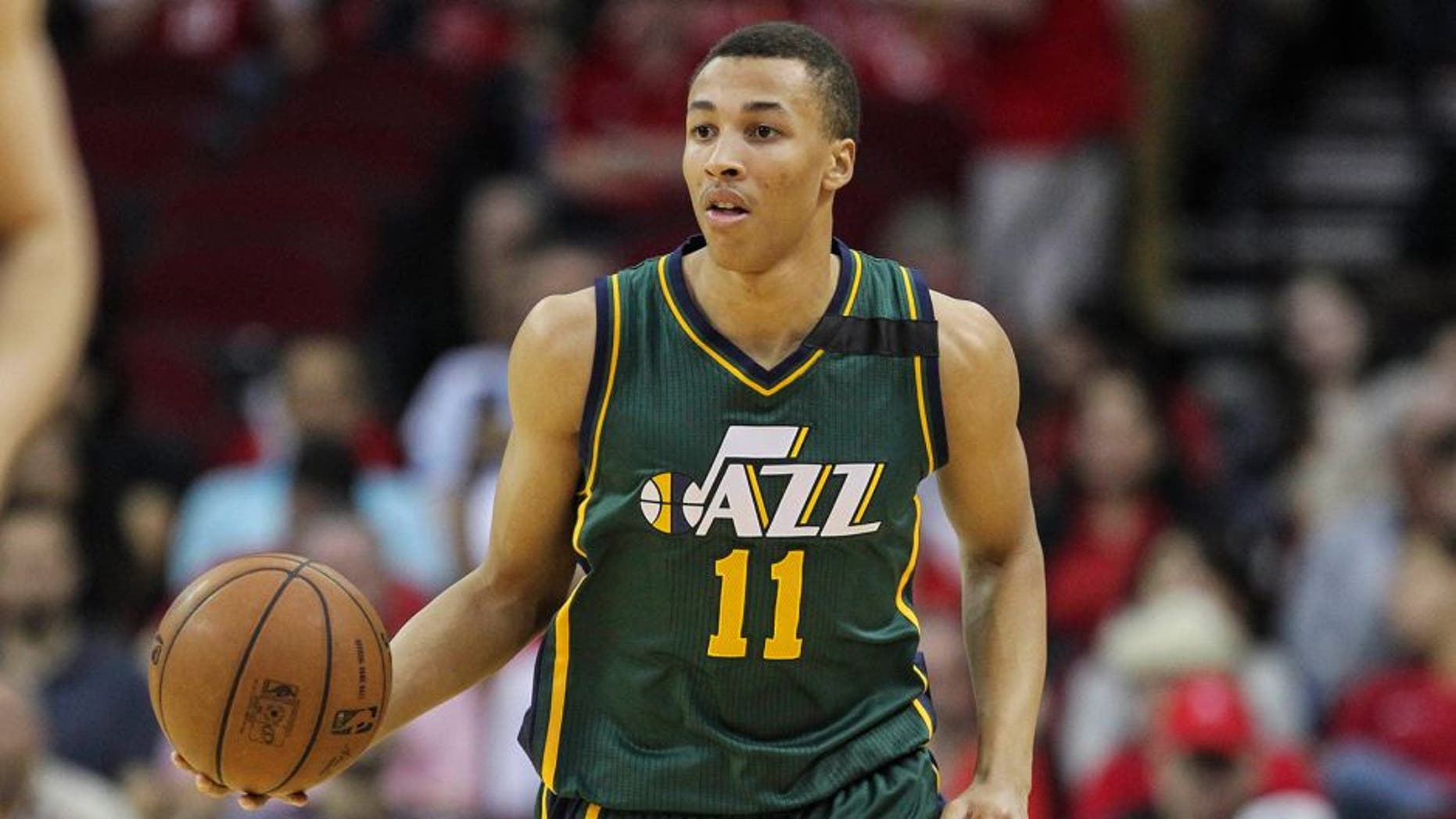 Apr 15, 2015; Houston, TX, USA; Utah Jazz guard Dante Exum (11) brings the ball up the court during the first quarter against the Houston Rockets at Toyota Center. Mandatory Credit: Troy Taormina-USA TODAY Sports
