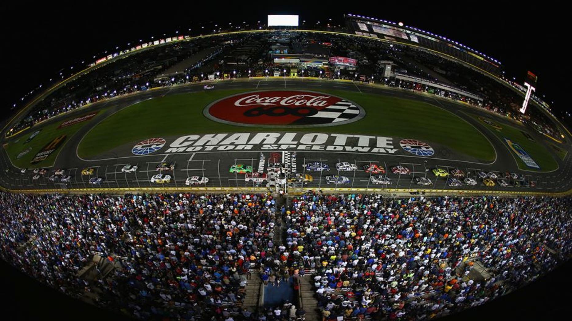 CONCORD, NC - MAY 26: The field restart during the NASCAR Sprint Cup Series Coca-Cola 600 at Charlotte Motor Speedway on May 26, 2013 in Concord, North Carolina. (Photo by Streeter Lecka/Getty Images)