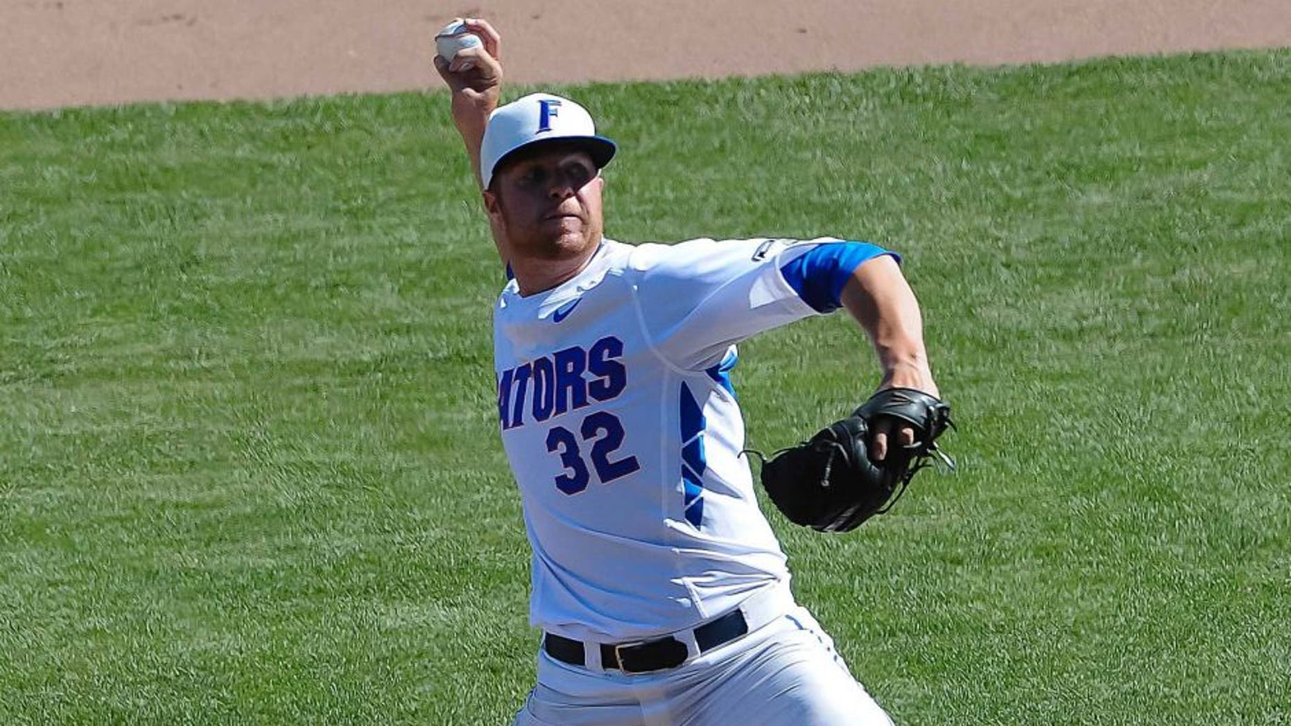 Jun 19, 2015; Omaha, NE, USA; Florida Gators pitcher Logan Shore (32) pitches in the seventh inning against the Virginia Cavaliers in the 2015 College World Series at TD Ameritrade Park. Florida defeated Virginia 10-5. Mandatory Credit: Steven Branscombe-USA TODAY Sports