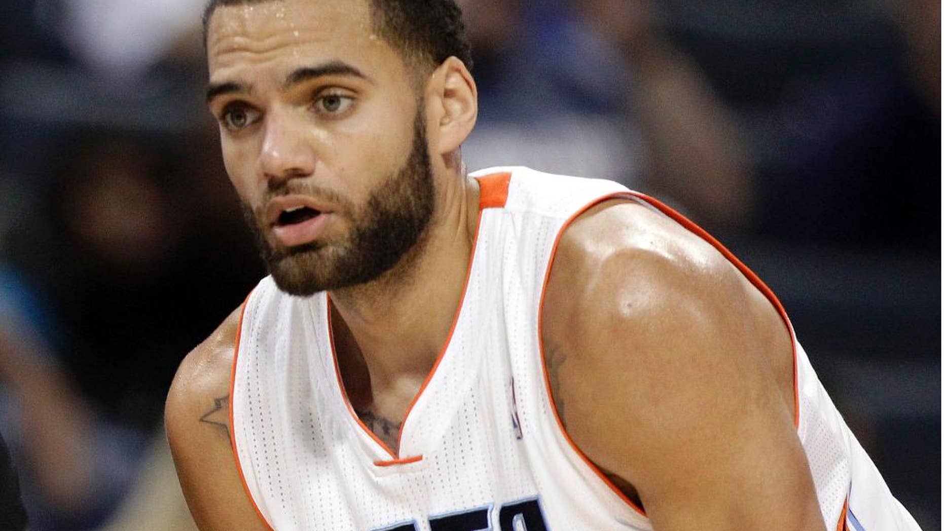 FILE - In this Nov. 10, 2012, file hoto, Charlotte Bobcats Jeffery Taylor listens to his coach during the first half of an NBA basketball game against the Dallas Mavericks in Charlotte, N.C. General manager Rich Cho said Monday, Sept. 29, 2014, that the Hornets are awaiting the outcome on an NBA investigation before deciding whether to reinstate Taylor following his arrest on domestic assault charges. (AP Photo/Chuck Burton, File)