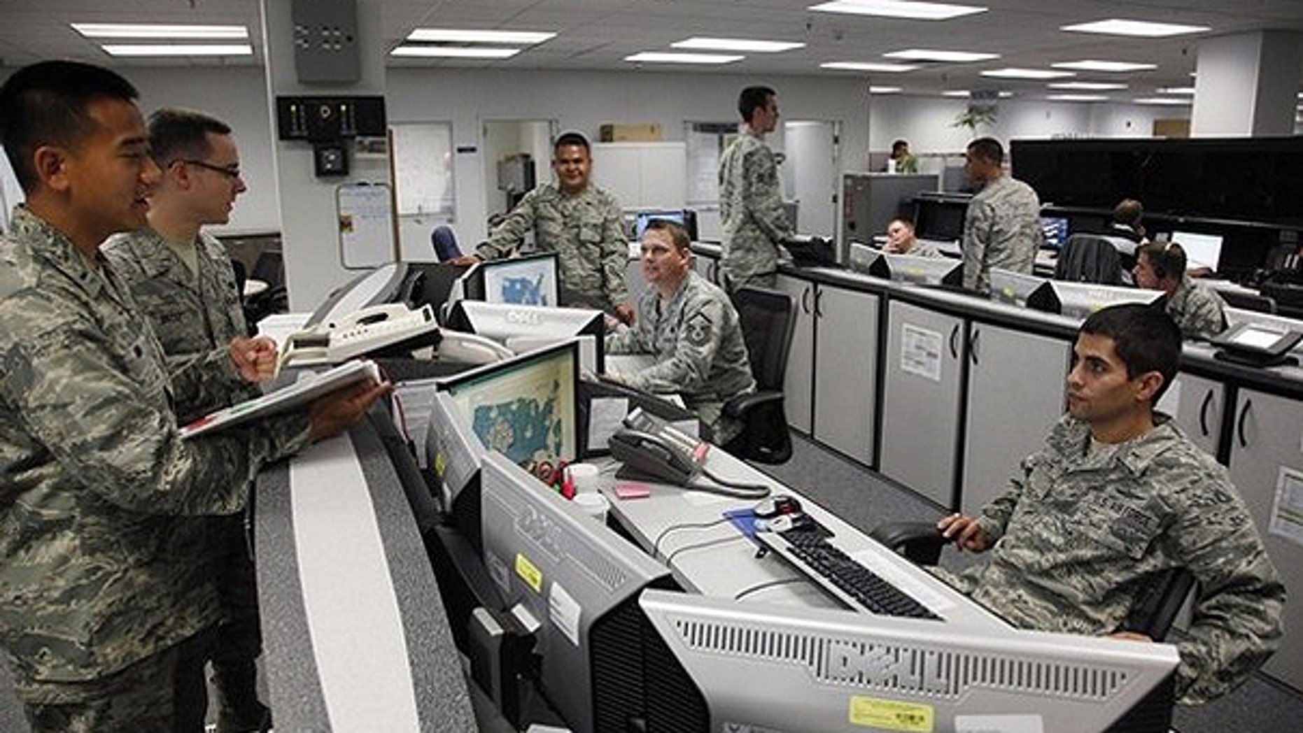 July 20, 2010: Personnel work at the Air Force Space Command Network Operations & Security Center at Peterson Air Force Base in Colorado Springs.