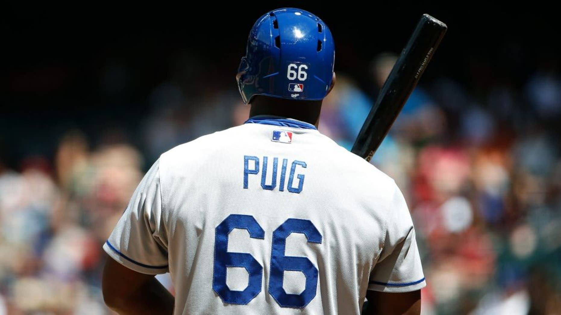 PHOENIX, AZ - APRIL 12: Yasiel Puig #66 of the Los Angeles Dodgers bats against the Arizona Diamondbacks during the MLB game at Chase Field on April 12, 2015 in Phoenix, Arizona. The Dodgers defeated the Diamondbacks 7-4. (Photo by Christian Petersen/Getty Images)