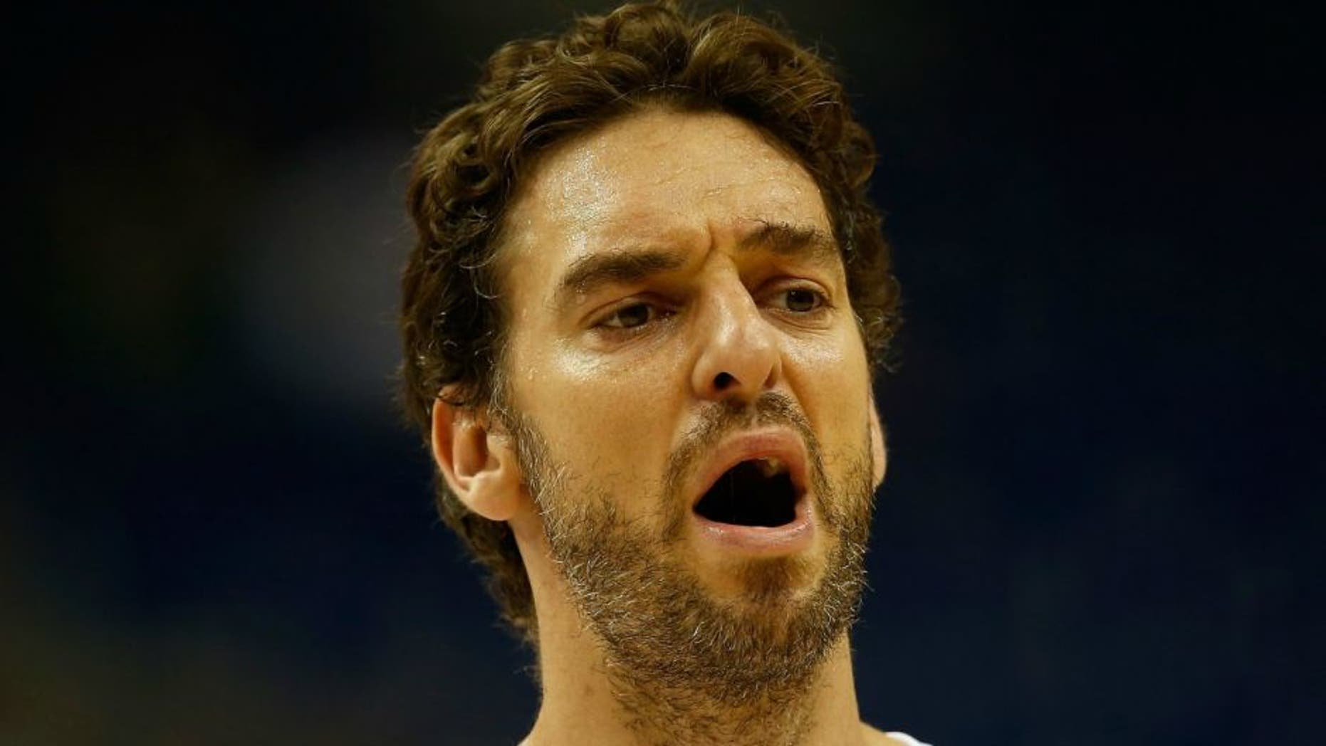 xxx (L) of Italy drives to the basket against yyy of Spain during the FIBA EuroBasket 2015 Group B basketball match between Spain and Italy at Arena of EuroBasket 2015 on September 8, 2015 in Berlin, Germany.