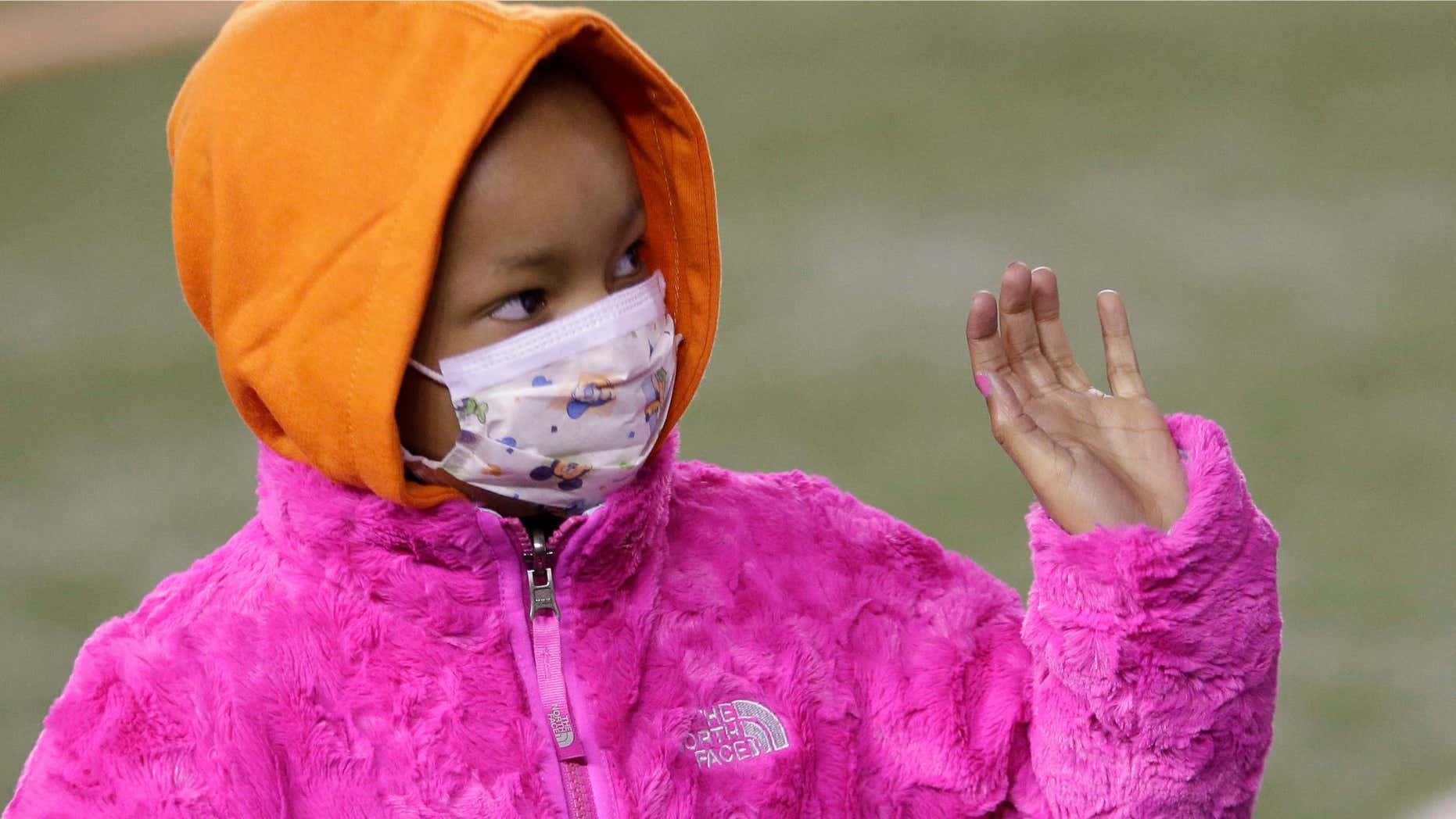 Nov. 6, 2014: Leah Still waves during a ceremony in the first half of an NFL football game between the Cincinnati Bengals and the Cleveland Browns in Cincinnati.