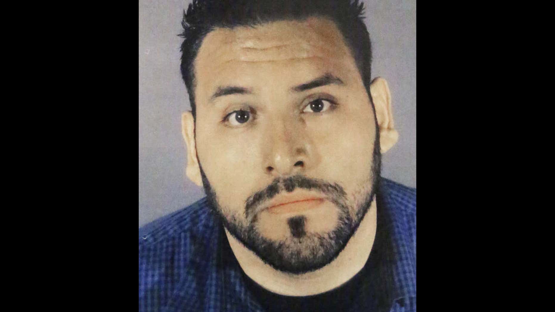 This undated booking photo provided by the Los Angeles Police Department shows Geovanni Borjas, 32, a suspect in the 2011 kidnapping and murders to two young women, on display during a news conference at Los Angeles police headquarters in downtown Los Angeles Tuesday, May 30, 2017.