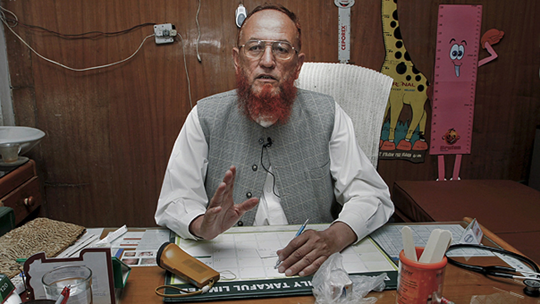 May 31: Pakistani pediatrician Mehar Dil Wazir, who has treated children of two close associates of slain Al Qaeda leader Usama bin Laden, speaks during an interview with The Associated Press at his clinic in Abbottabad, Pakistan.
