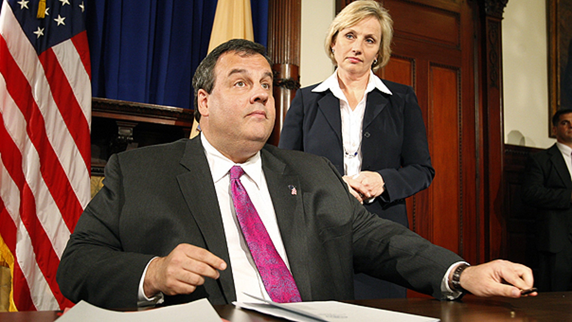 In this Thursday, May 20, 2010 file picture, Gov. Chris Christie reacts in Trenton, N.J. after vetoing a measure to restore a higher income tax on those making more than $1 million.