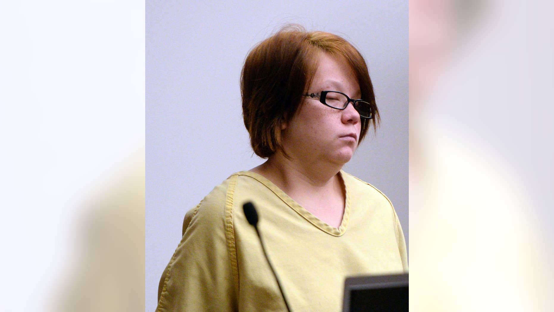 FILE - In this Sept. 10, 2014, file photo, Alicia Englert, accused of dumping her newborn in a trashcan to die, makes her initial appearance in court, in Salt Lake City. A judge is letting Englert have a goodbye visit with her infant daughter, who authorities say survived after the woman left her in a trashcan to die. Judge Elizabeth Hruby-Mills decided Monday, Dec. 8, 2014 that Englert will have one supervised 90-minute visit with the now 3-month-old child Dec. 15. The girl is being adopted by another family after Englert waived her parental rights. (AP Photo/The Salt Lake Tribune, Al Hartmann, Pool, File)