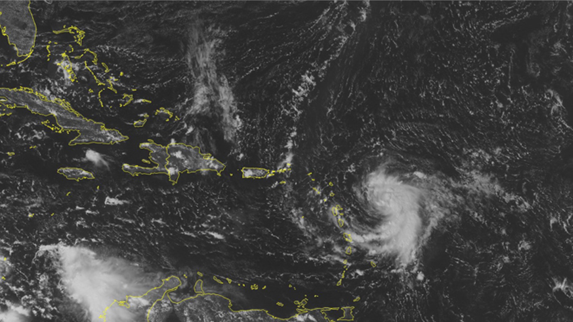 This NOAA satellite image taken Sunday, October 12, 2014 at 01:45 PM EDT shows Tropical Storm Fay just to the northeast of Bermuda moving out into the central Atlantic. Newly formed Tropical Storm Gonzalo moves into the Lesser Antilles with maximum wind gusts of 40 miles per hour. Tropical Storm Warnings are active for the northern islands and Tropical Storm Watches are active for Puerto Rico. (AP Photo/Weather Underground)