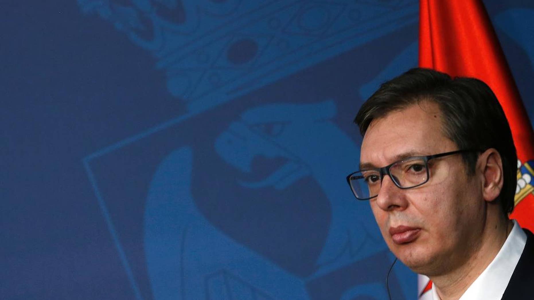 Serbian Prime Minister, Aleksandar Vucic, listens to OSCE Chairperson-in-Office and Austrian Foreign Minister, Sebastian Kurz, during a press conference in Belgrade, Serbia, Monday, Feb. 13, 2017. Kurz is on a one-day visit to Serbia. (AP Photo/Darko Vojinovic)