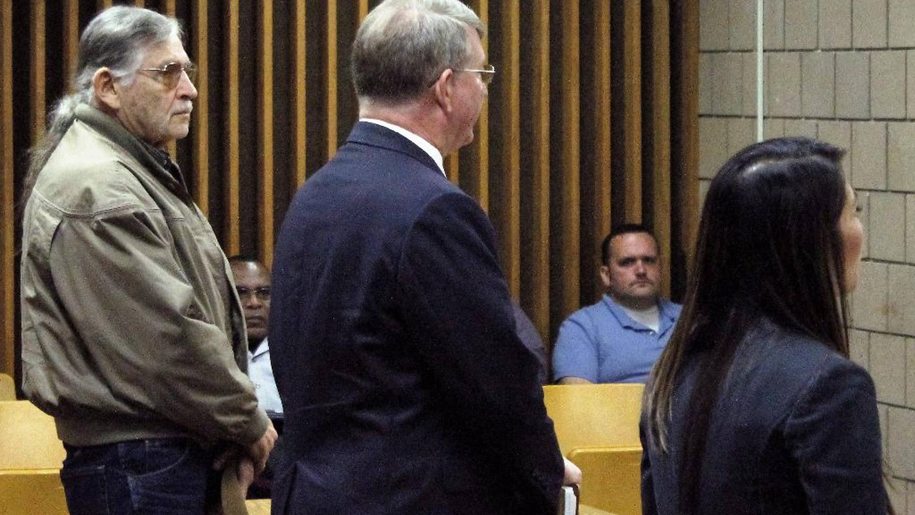 John Franklin McGraw, far left, listens to Cumberland County Assistant District Attorney Bella Troung during an appearance in Cumberland County District Court in Fayetteville, N.C., Wednesday, April 6, 2016. McGraw is charged in connection with an assault on a demonstrator at a Donald Trump campaign in Fayetteville last month. Both the defense and the prosecution agreed to the case being continued until July 13. (AP Photo/Skip Foreman)