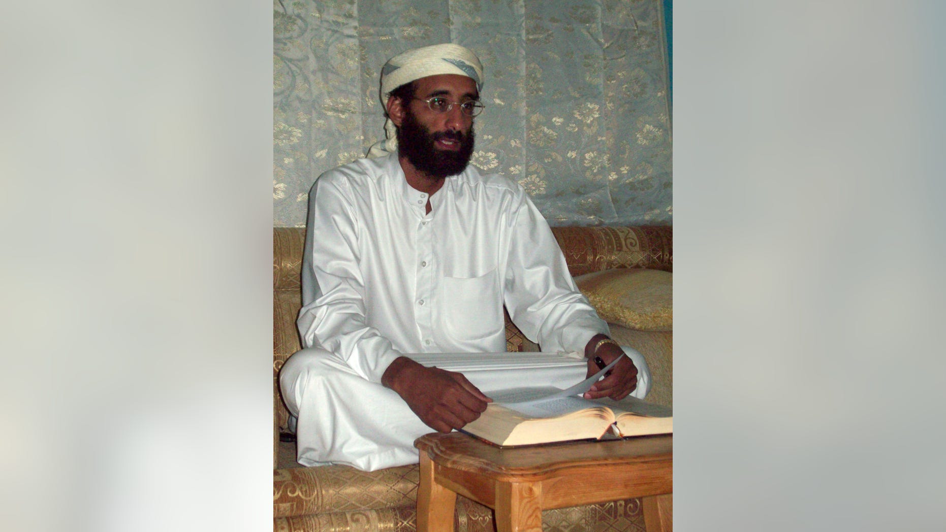 FILE - This Oct. 2008 file photo by Muhammad ud-Deen shows Imam Anwar al-Awlaki in Yemen. A Justice Department document says it is legal for the government to kill U.S. citizens abroad if it believes they are senior al-Qaida leaders continually engaged in operations aimed at killing Americans. (AP Photo/Muhammad ud-Deen, File) ** MANDATORY CREDIT NO SALES **