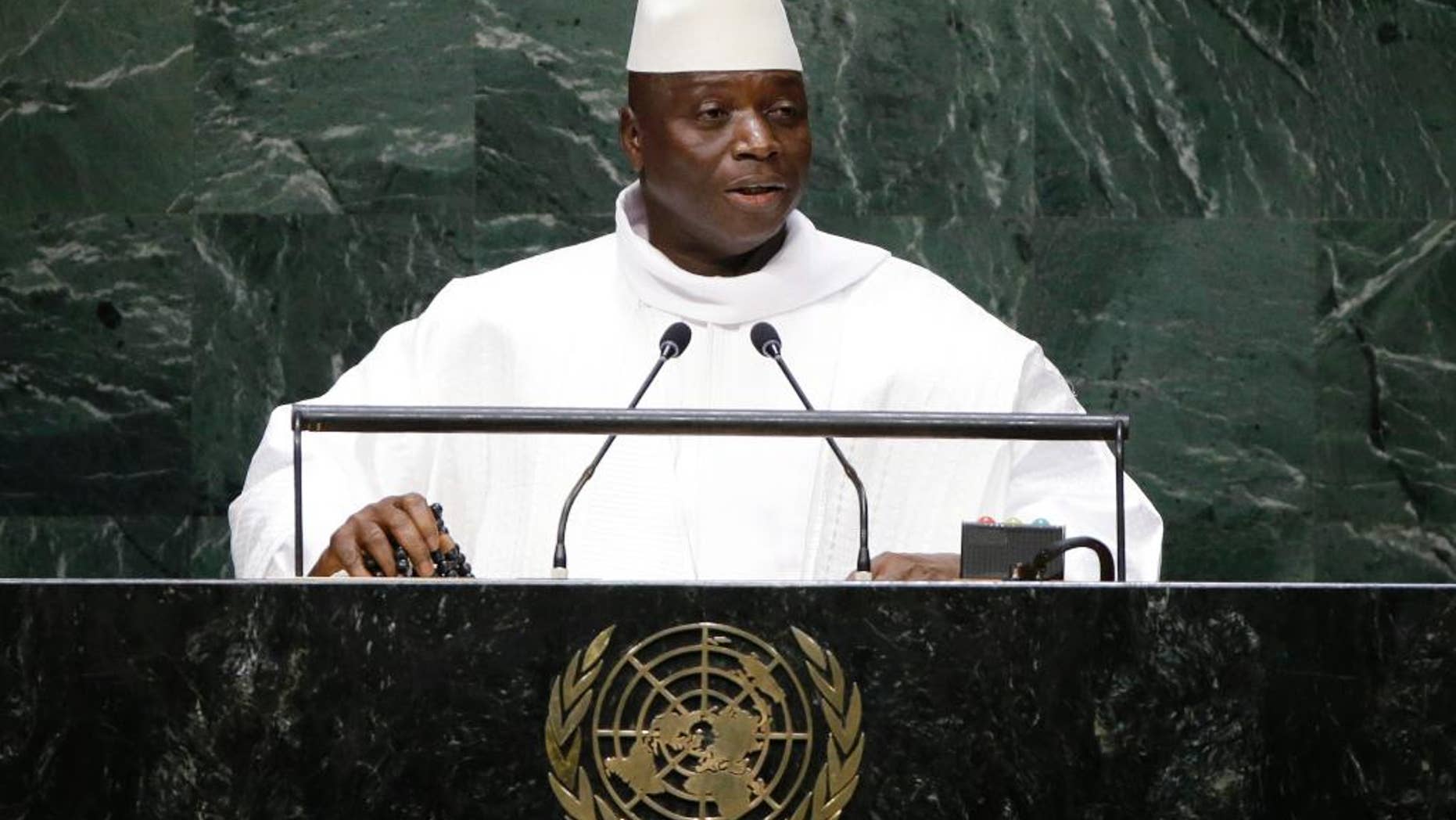 FILE - In this Sept. 25, 2014, file photo, Gambia's President Yahya Jammeh addresses the 69th session of the United Nations General Assembly at the United Nations headquarters. A third African country, Gambia, says it will leave the International Criminal Court as fears grow of a mass pullout from the body that pursues some of the world's worst atrocities. Gambia announced the decision on television Tuesday, Oct. 25, 2016, accusing the court of unfairly targeting Africa and calling it the "International Caucasian Court." (AP Photo/Frank Franklin II, File)