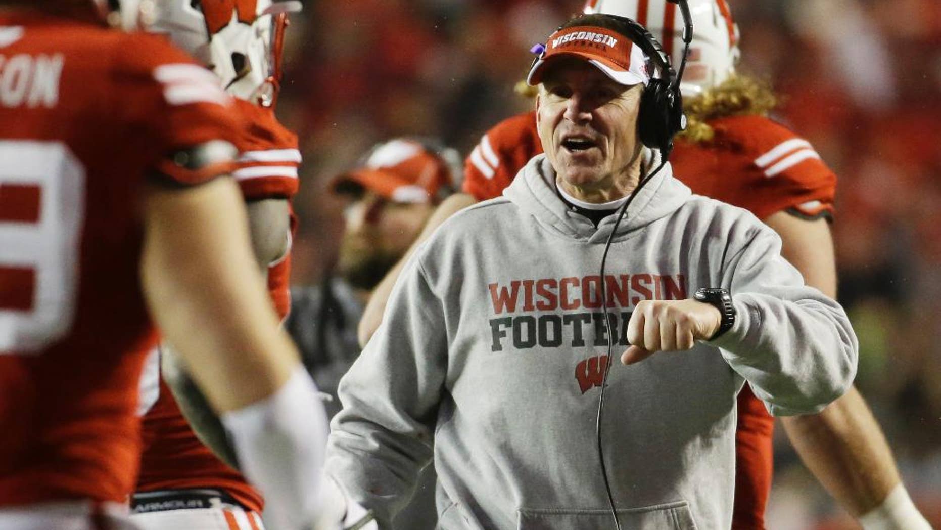 Wisconsin head coach Gary Andersen celebrates after a touchdown during the second half of an NCAA college football game against Nebraska Saturday, Nov. 15, 2014, in Madison, Wis. (AP Photo/Morry Gash)