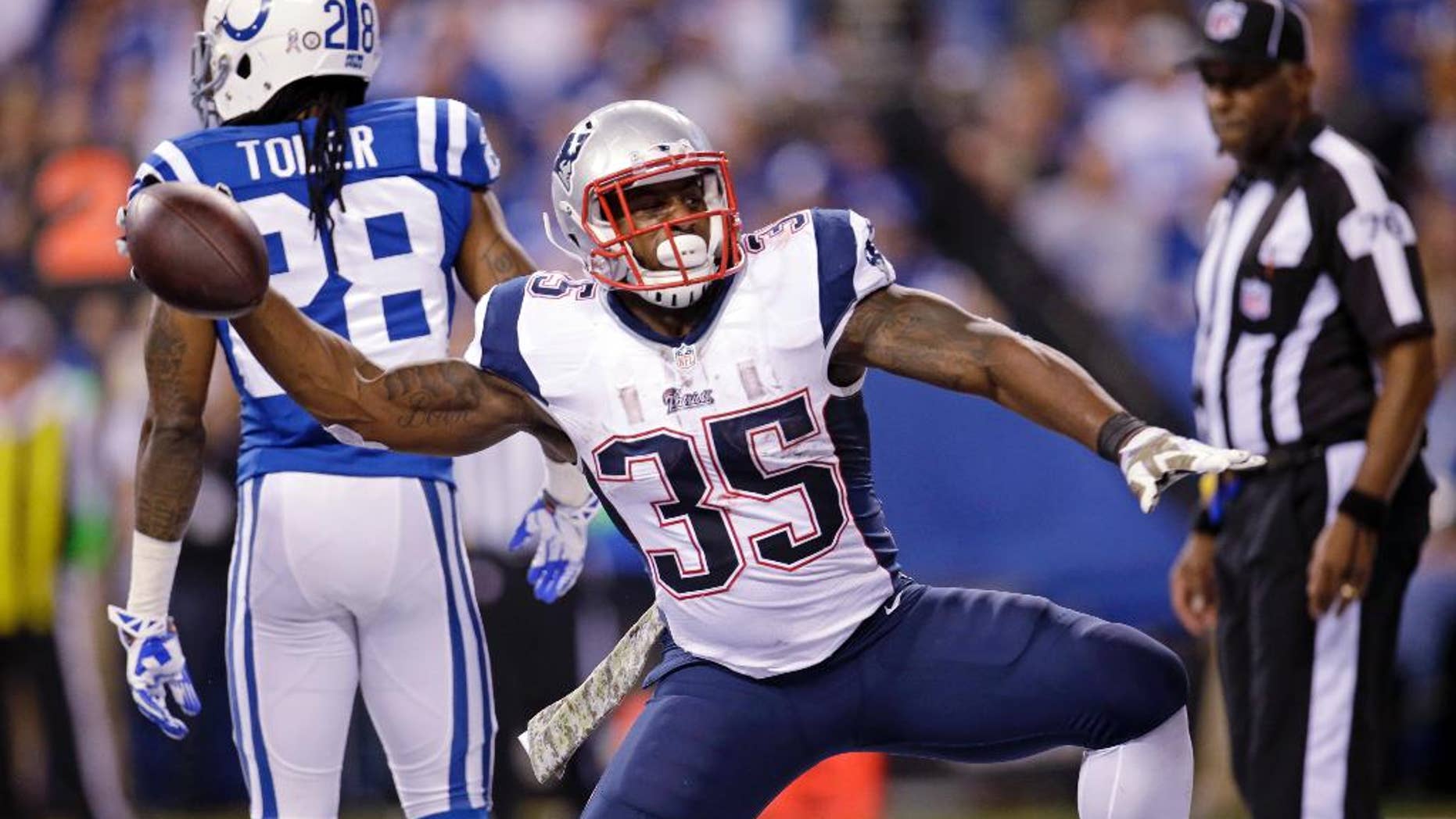 New England Patriots running back Jonas Gray celebrates after scoring a touchdown against the Indianapolis Colts during the first half of an NFL football game in Indianapolis, Sunday, Nov. 16, 2014. (AP Photo/AJ Mast)