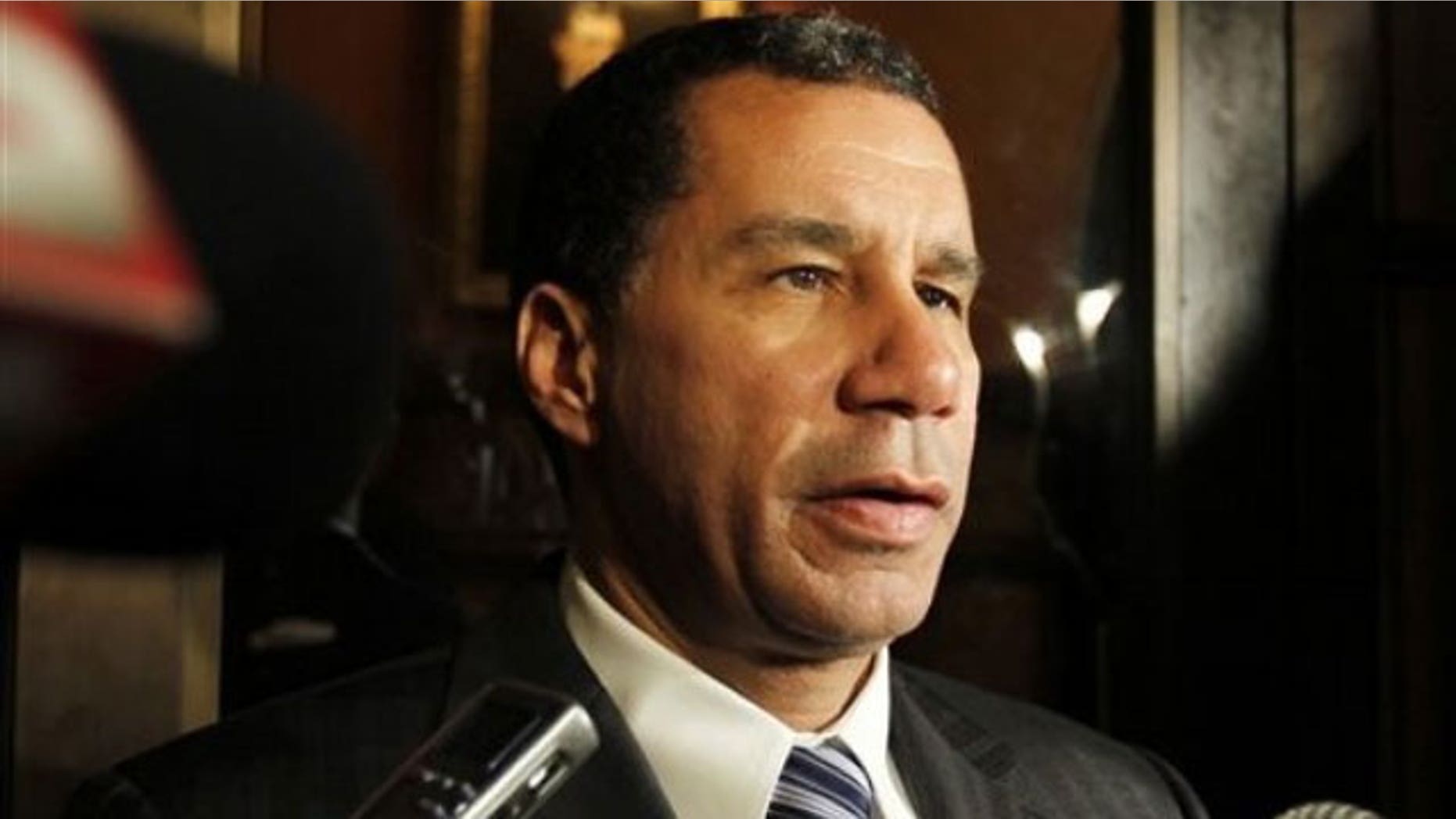 May 12: Gov. David Paterson talks to reporters outside his office at the Capitol in Albany, N.Y. (AP).