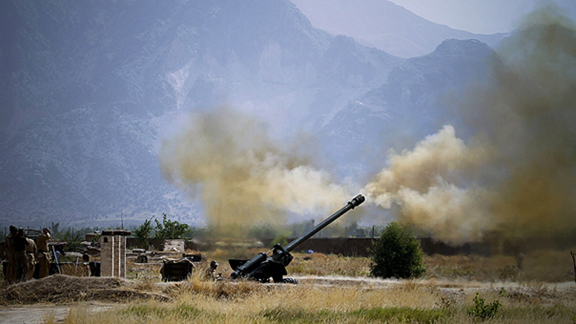 June 1: Pakistani troops fire heavy artillery toward alleged militants hideouts in the mountain ranges in Mamad Gat, in Pakistan's Mohmand tribal region along the Afghan border.