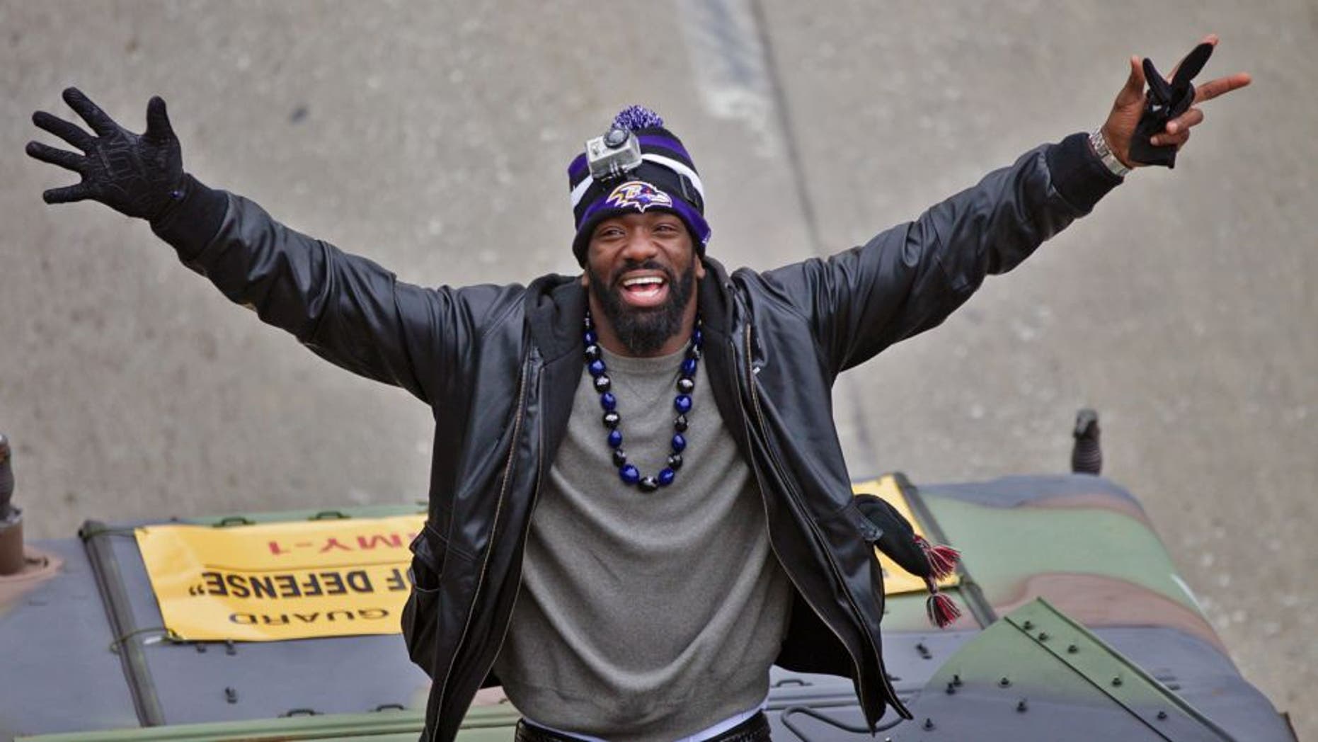 Feb 5, 2013; Baltimore, MD, USA; Baltimore Ravens safety Ed Reed (20) waves to fans during the Baltimore Ravens victory parade and celebration for Super Bowl XLVII through the streets of Baltimore. Mandatory Credit: Maxwell Kruger-USA TODAY Sports