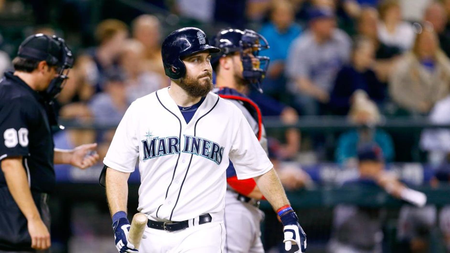 May 28, 2015; Seattle, WA, USA; Seattle Mariners left fielder Dustin Ackley (13) walks back to the dugout after striking out during the ninth inning of a 5-3 loss to the Cleveland Indians at Safeco Field. Mandatory Credit: Joe Nicholson-USA TODAY Sports
