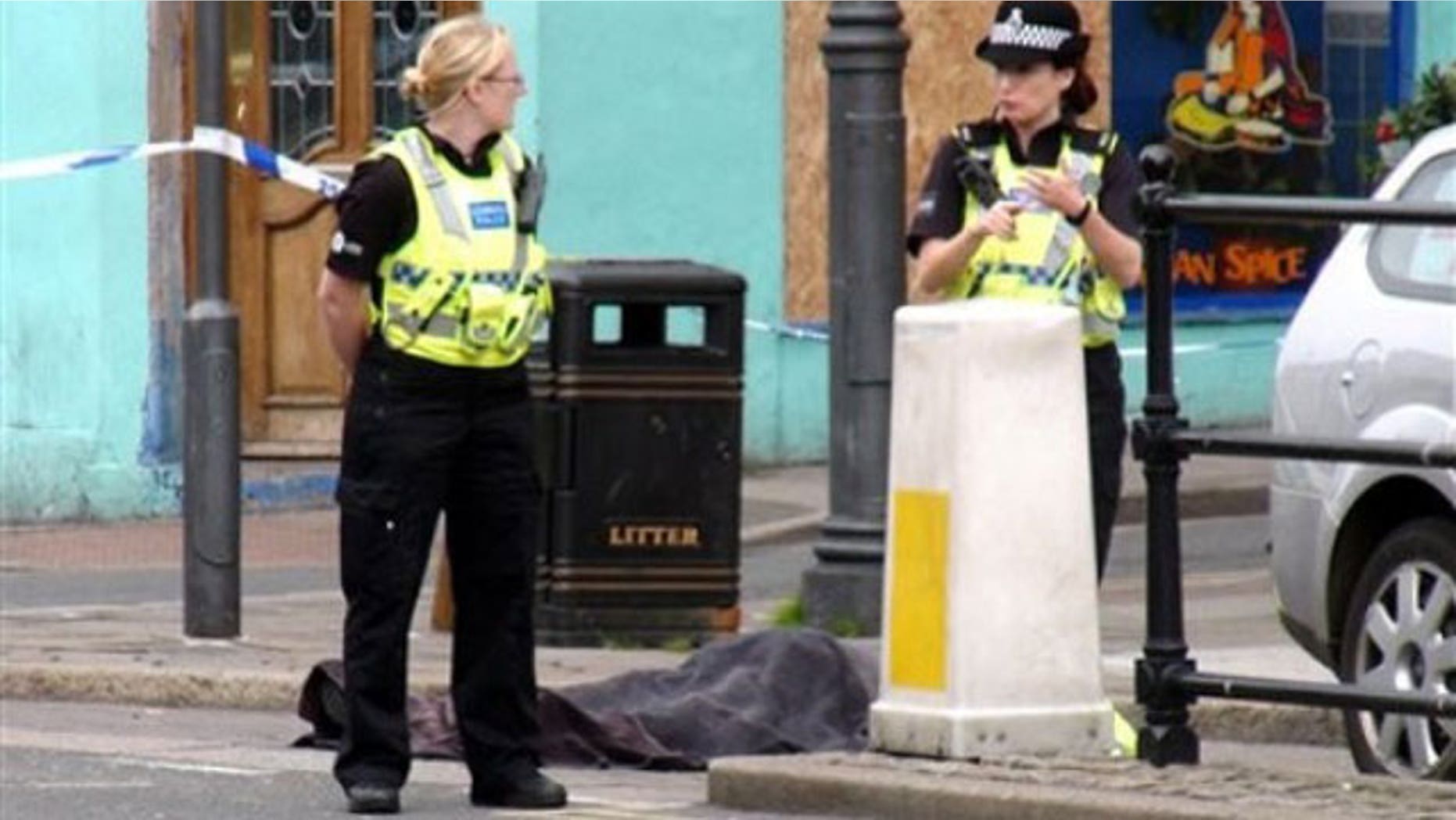 June 2: Police stand next to a body following a shooting on Duke Street, in the town of Whitehaven in northwest England. British police were hunting down a man suspected in a shooting spree that has left more than one person dead in northwest England. The Cumbria Constabulary said there have been "a number of fatalities" as well as several injuries after shots were fired in the town of Whitehaven and nearby Seascale and Egremont (AP).