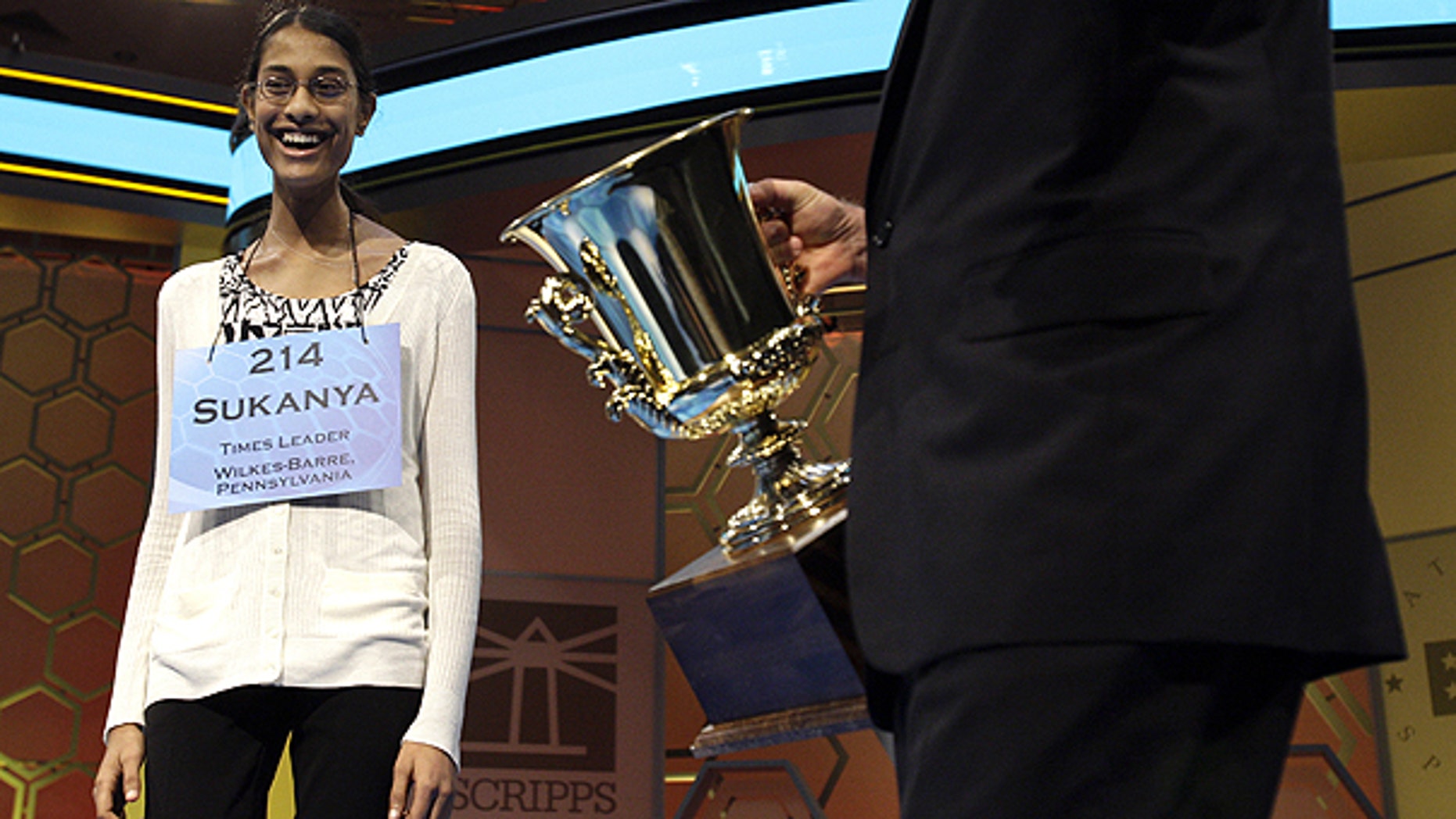 June 2: Sukanya Roy, 14, of South Abington Township, Pa., is presented the trophy after winning the National Spelling Bee, in Oxon Hill, Md.