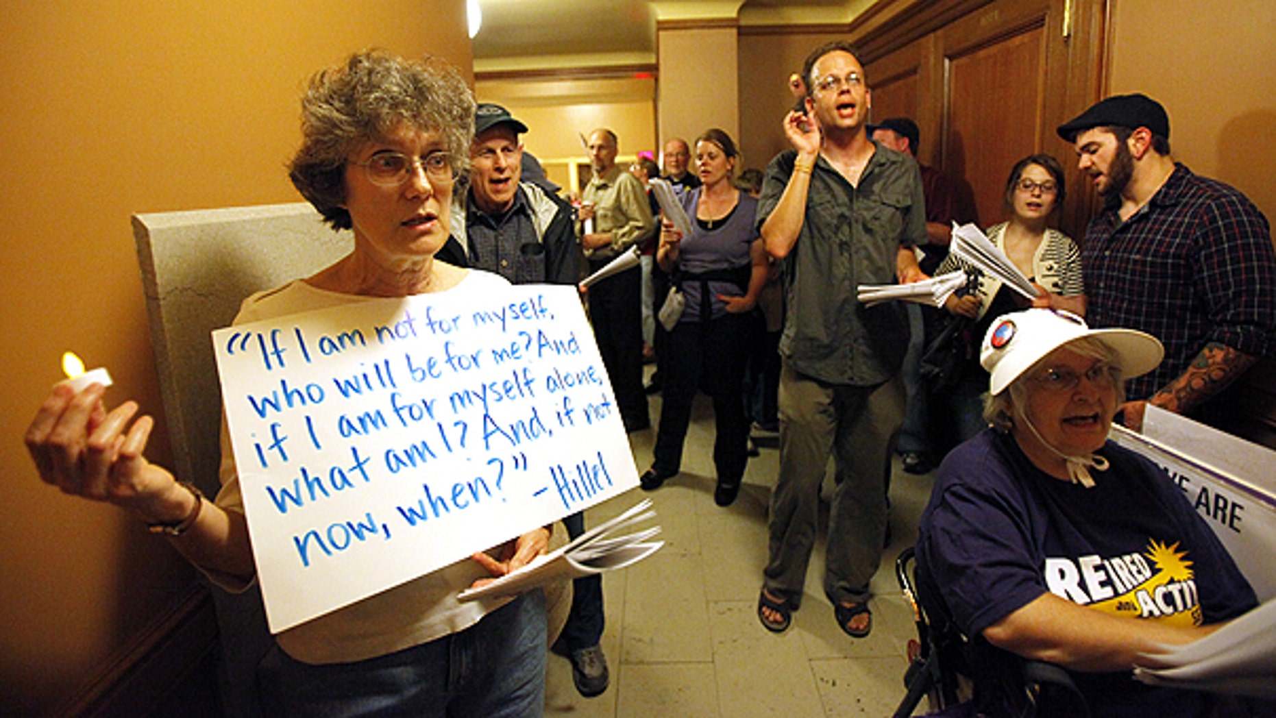 June 2: Protesters wait to be let into a meeting of the Joint Committee on Finance at the state Capitol in Madison, Wis.